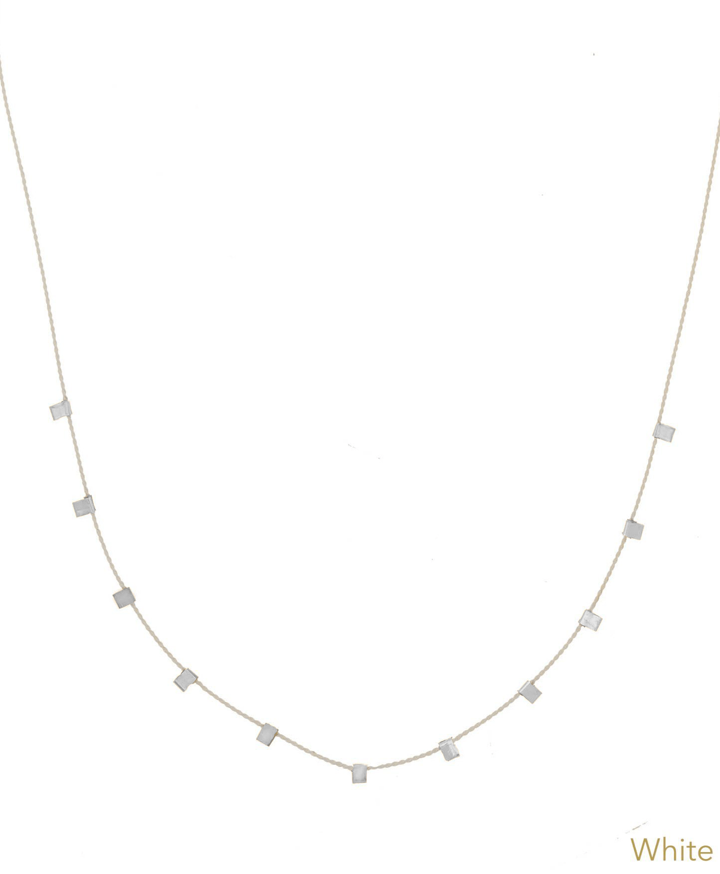 Hilo Necklace by KOZAKH. A 16 inch long natural silk thread necklace, embellished with Sterling Silver square cut metals.