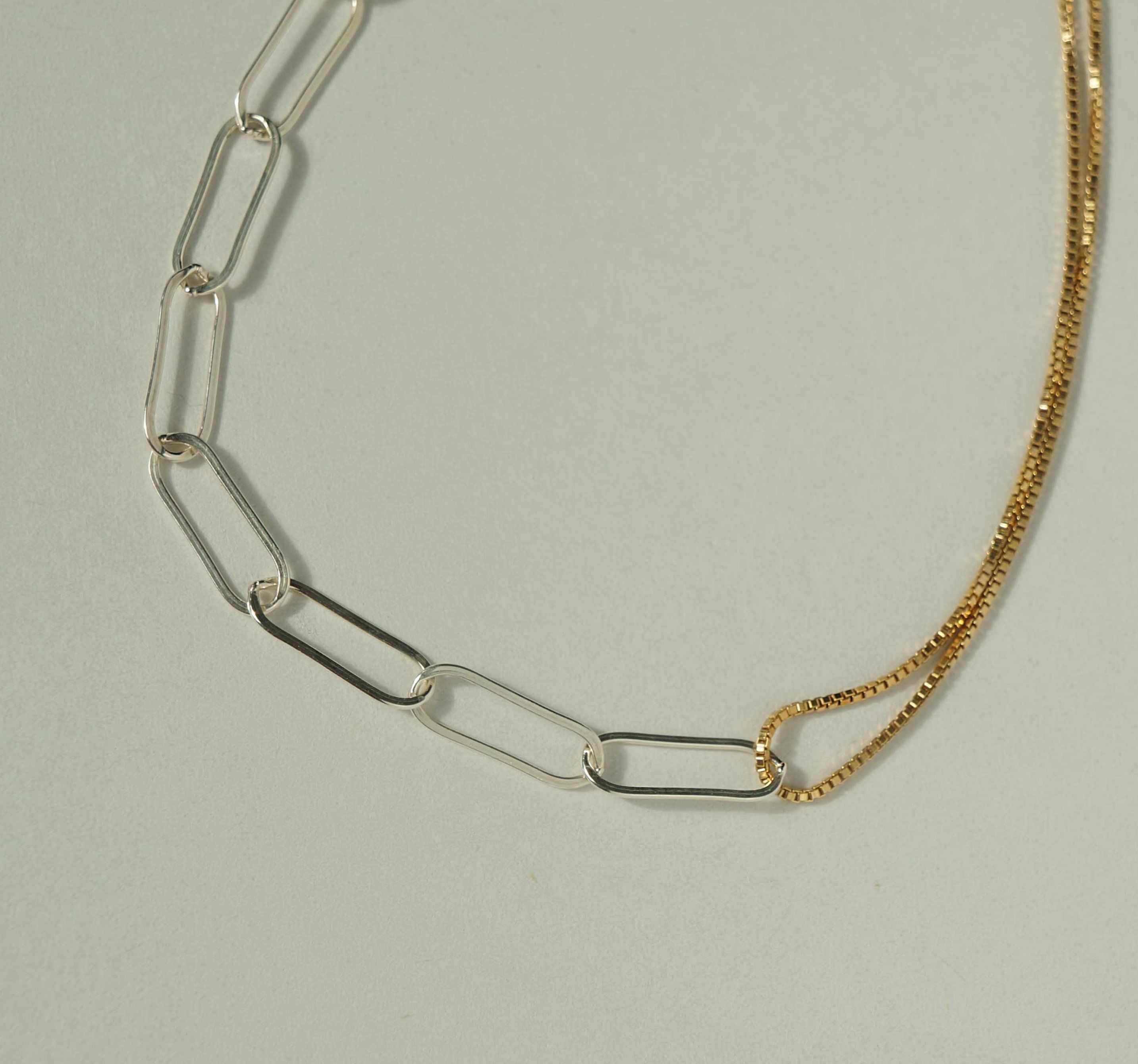Isabella Necklace by KOZAKH. A 14 to 16 inch adjustable length combo chain necklace with gold box chain and silver paperclip chain. The Flat Link Chain is in Sterling Silver chain and the 1mm Box chain is in 14k Gold Filled.