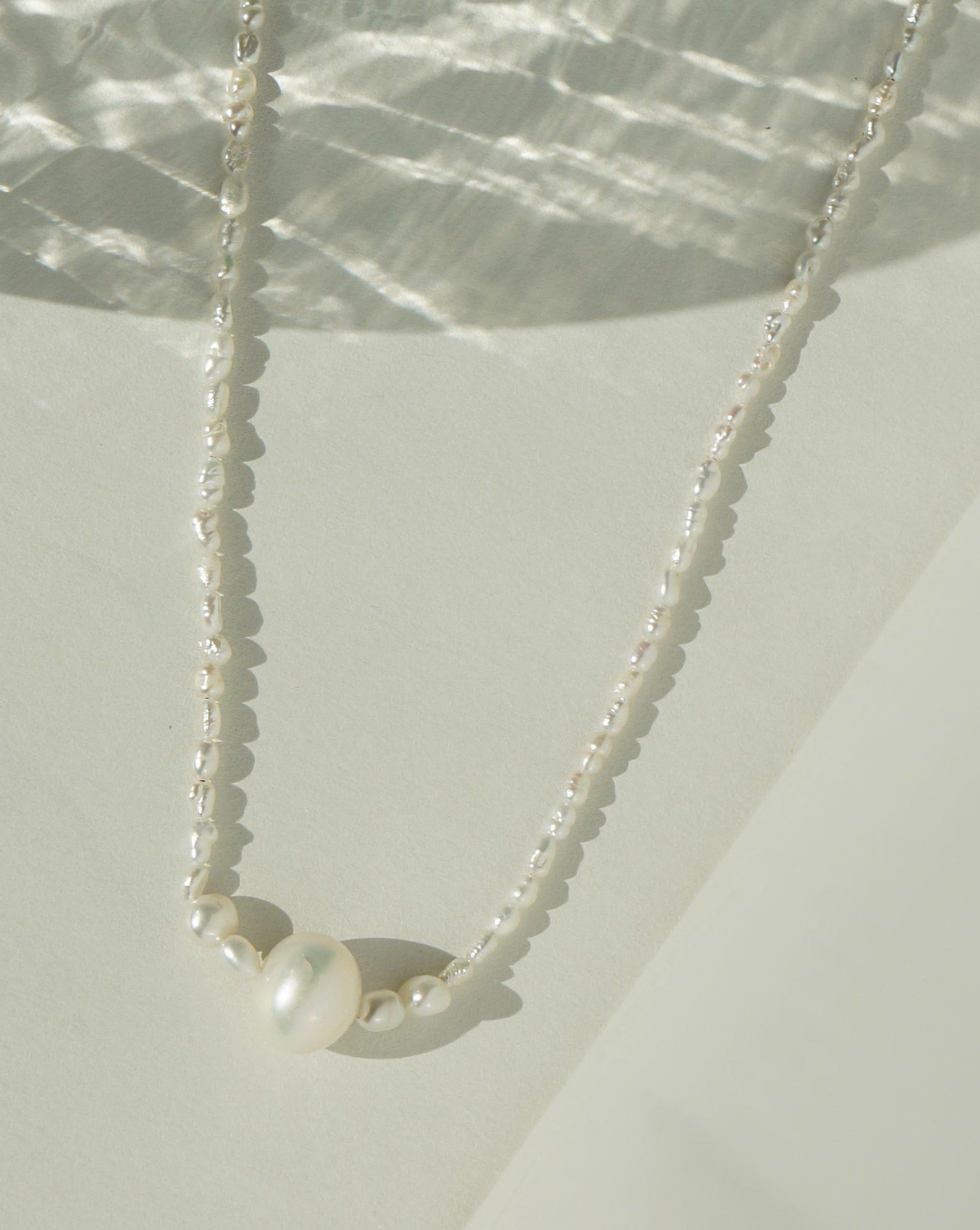 Kinsley Necklace by KOZAKH. A 14 to 16 inch adjustable length, Freshwater Pearls beaded necklace with 14K Gold Filled clasp.