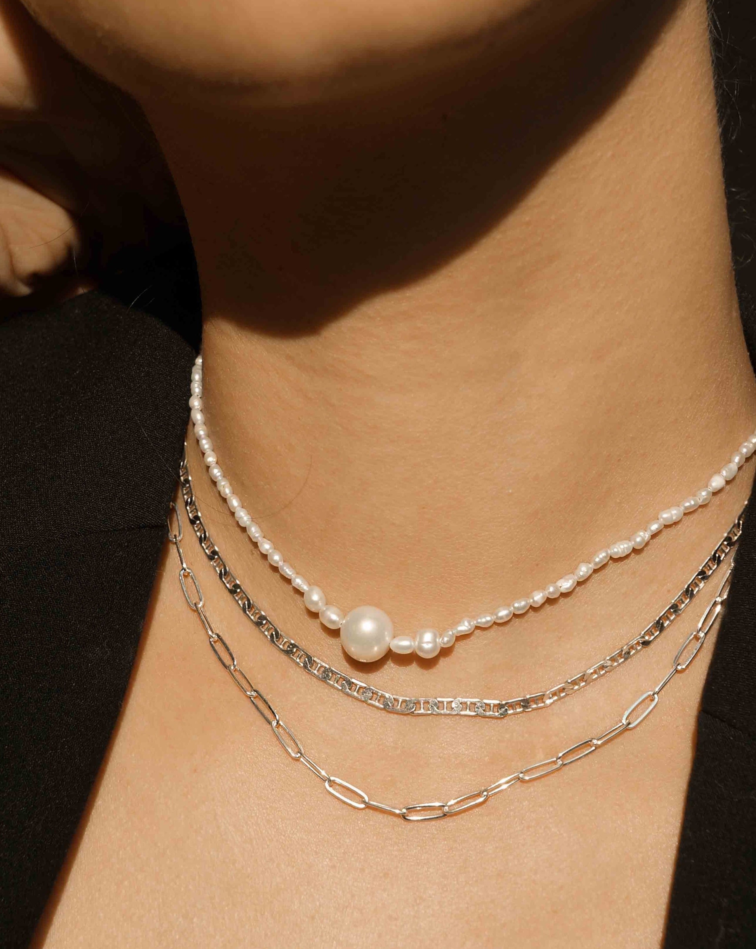 Kinsley Necklace by KOZAKH. A 14 to 16 inch adjustable length, Freshwater Pearls beaded necklace with 14K Gold Filled clasp.