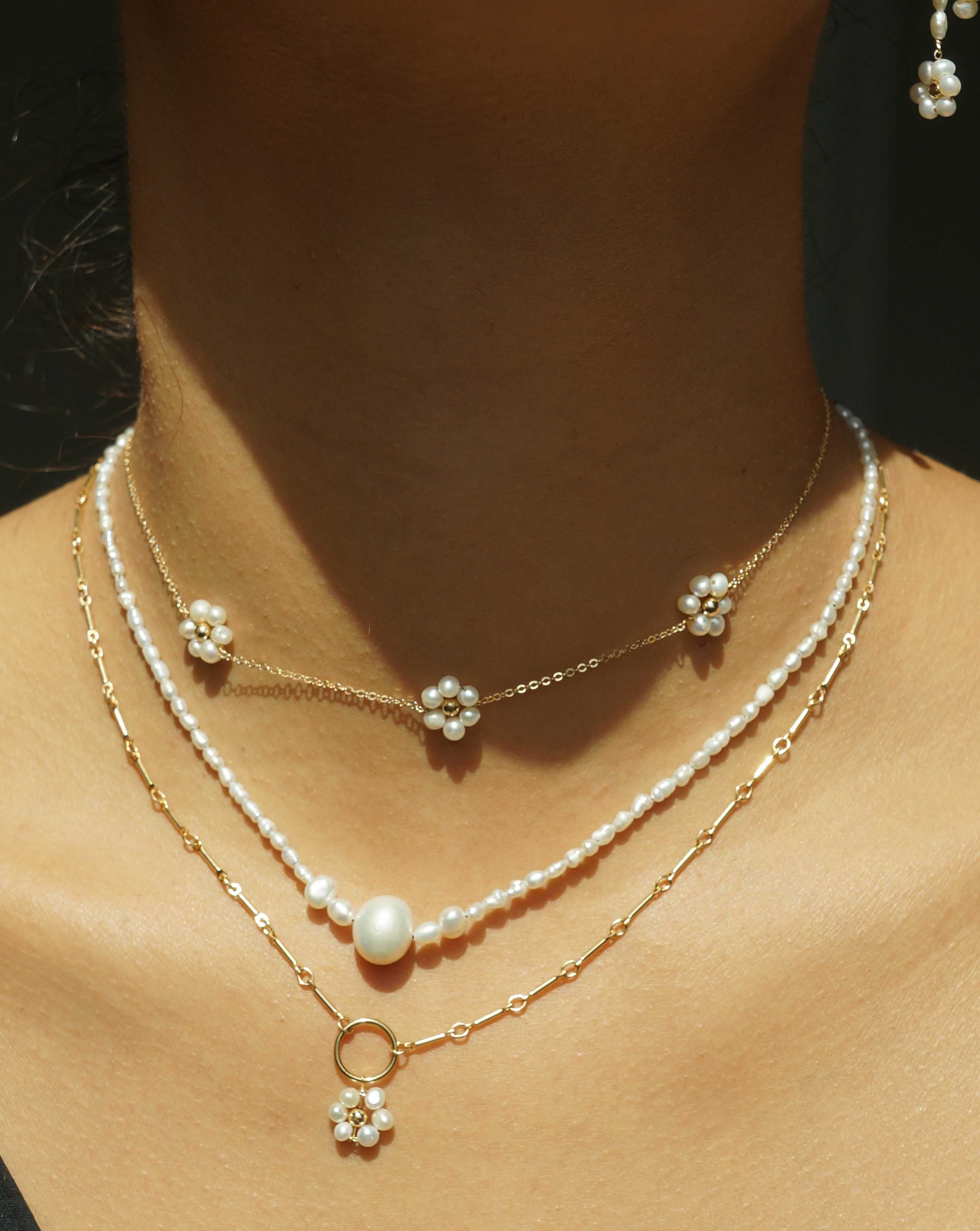 Kinsley Necklace by KOZAKH. A 14 to 16 inch adjustable length, Freshwater Pearls beaded necklace with 14K Gold Filled clasp.