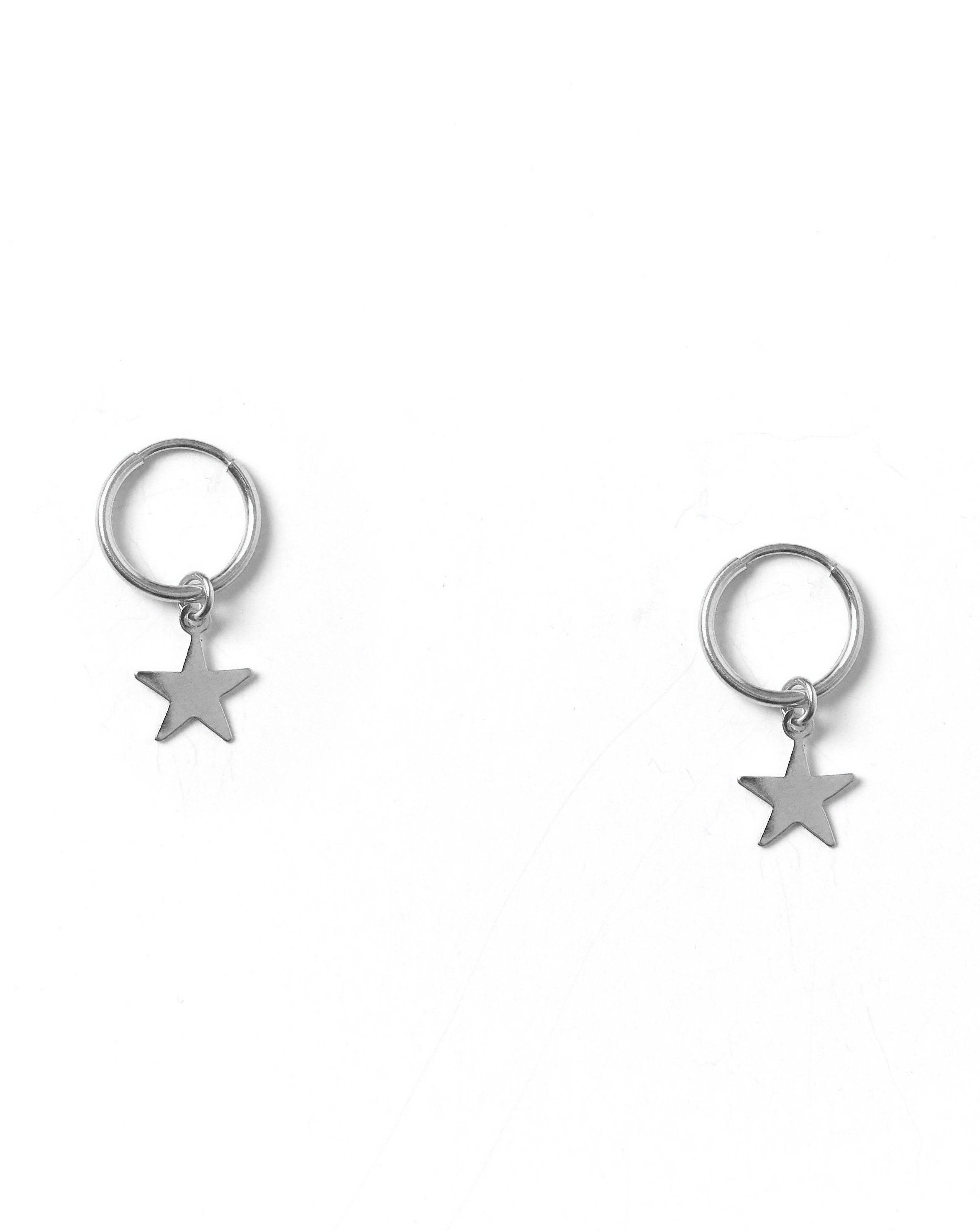 Kisstar Hoop Earrings by KOZAKH. 12mm hoop earrings, crafted in Sterling Silver, featuring a star charm.