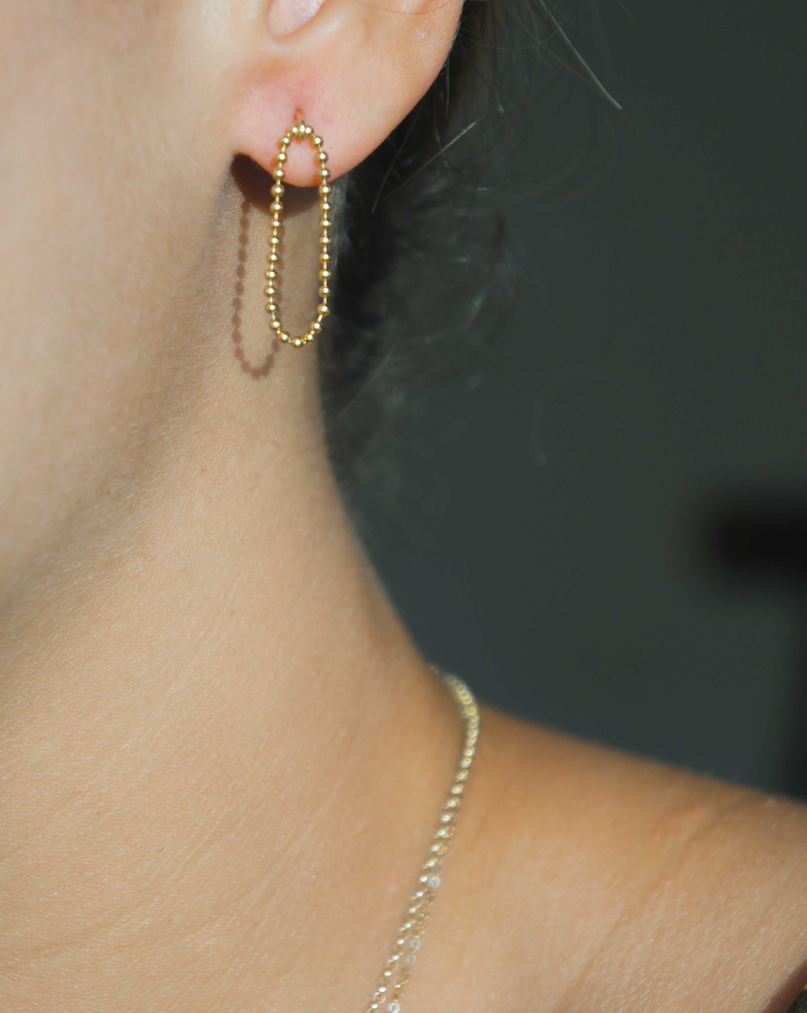 Lata Earrings by KOZAKH. 14K Gold Filled drop style stud earrings, with drop length of 1 inch, featuring linked gold balls.