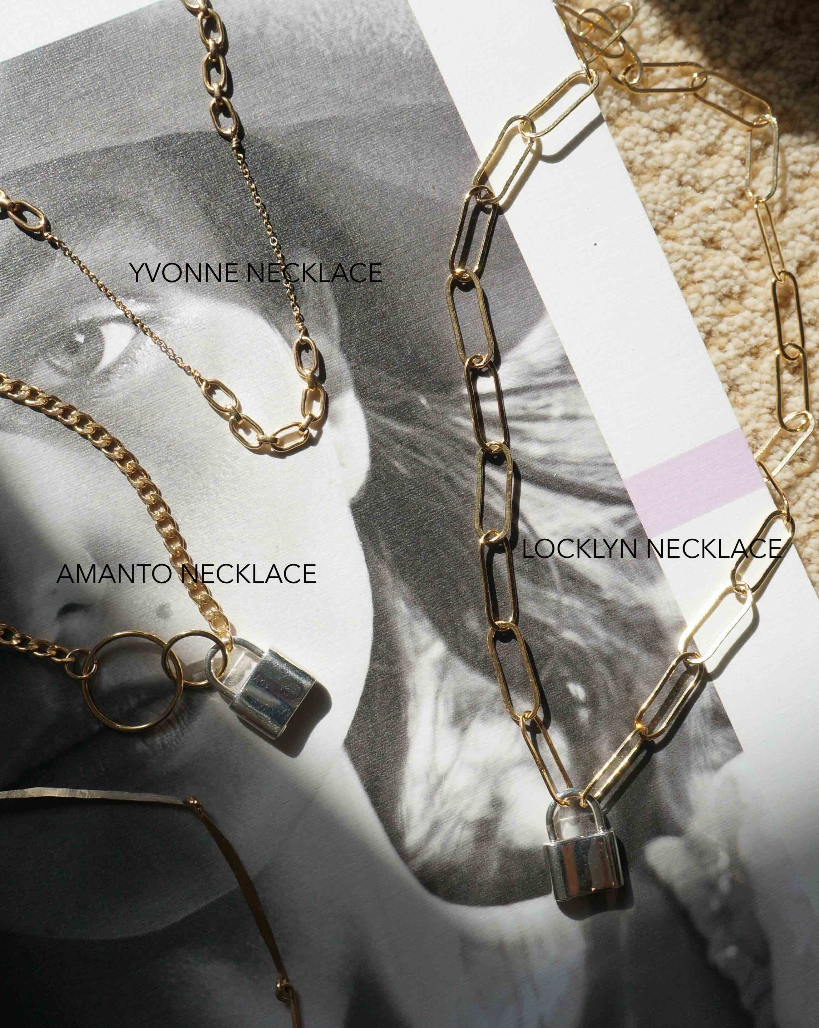 Locklyn Necklace by KOZAKH. A 15 inches long paperclip style chain necklace, crafted in 14K Gold Filled, featuring a Sterling Silver padlock closure.