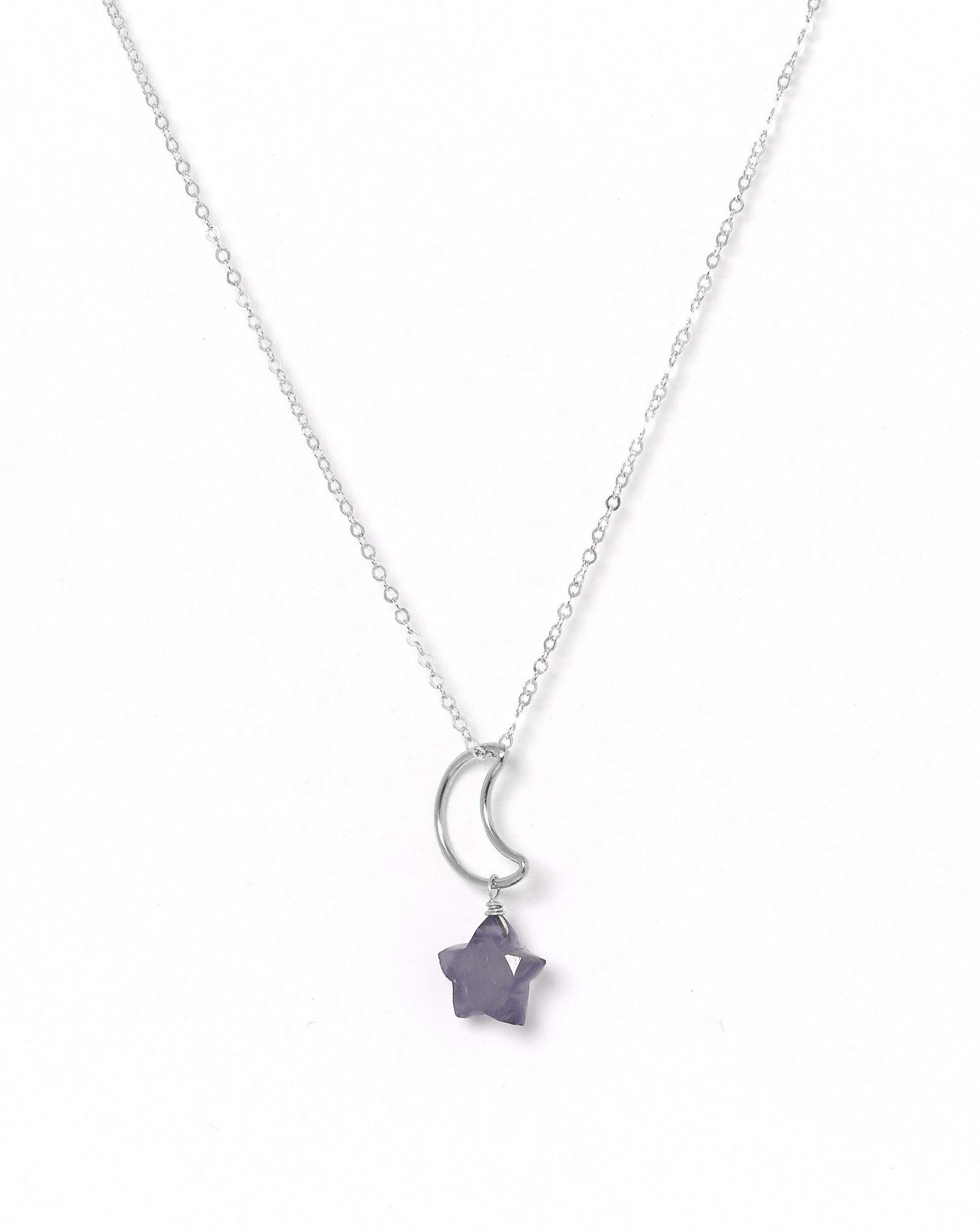 Lunastar Necklace by KOZAKH. A 16 to 18 inch adjustable length necklace, crafted in Sterling Silver, featuring a 13mm moon charm and an Iolite star charm.