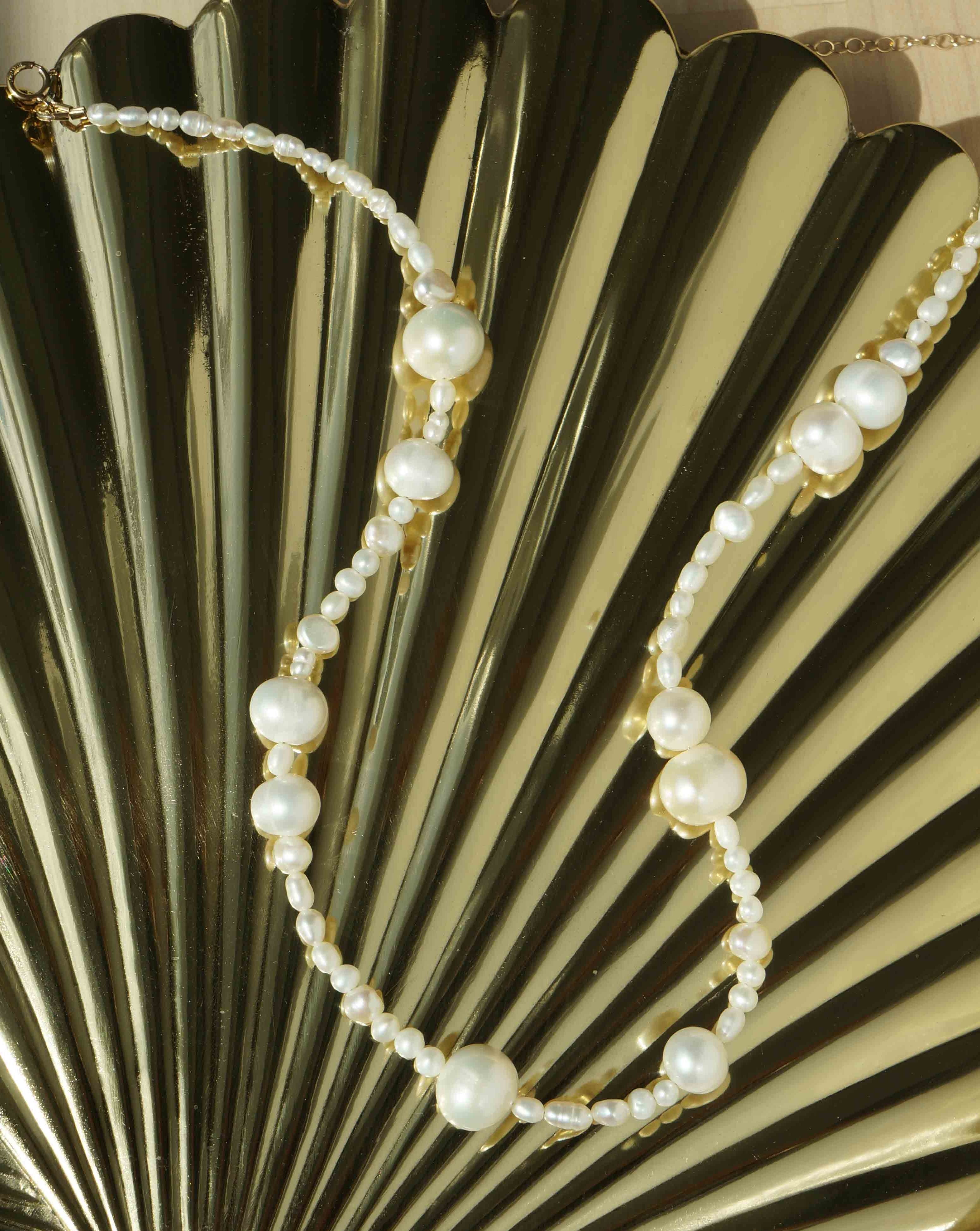 Madelyn Necklace by KOZAKH. A 14 to 16 inch adjustable length necklace with a strand of Freshwater Pearls, with a 14K Gold Filled clasp.