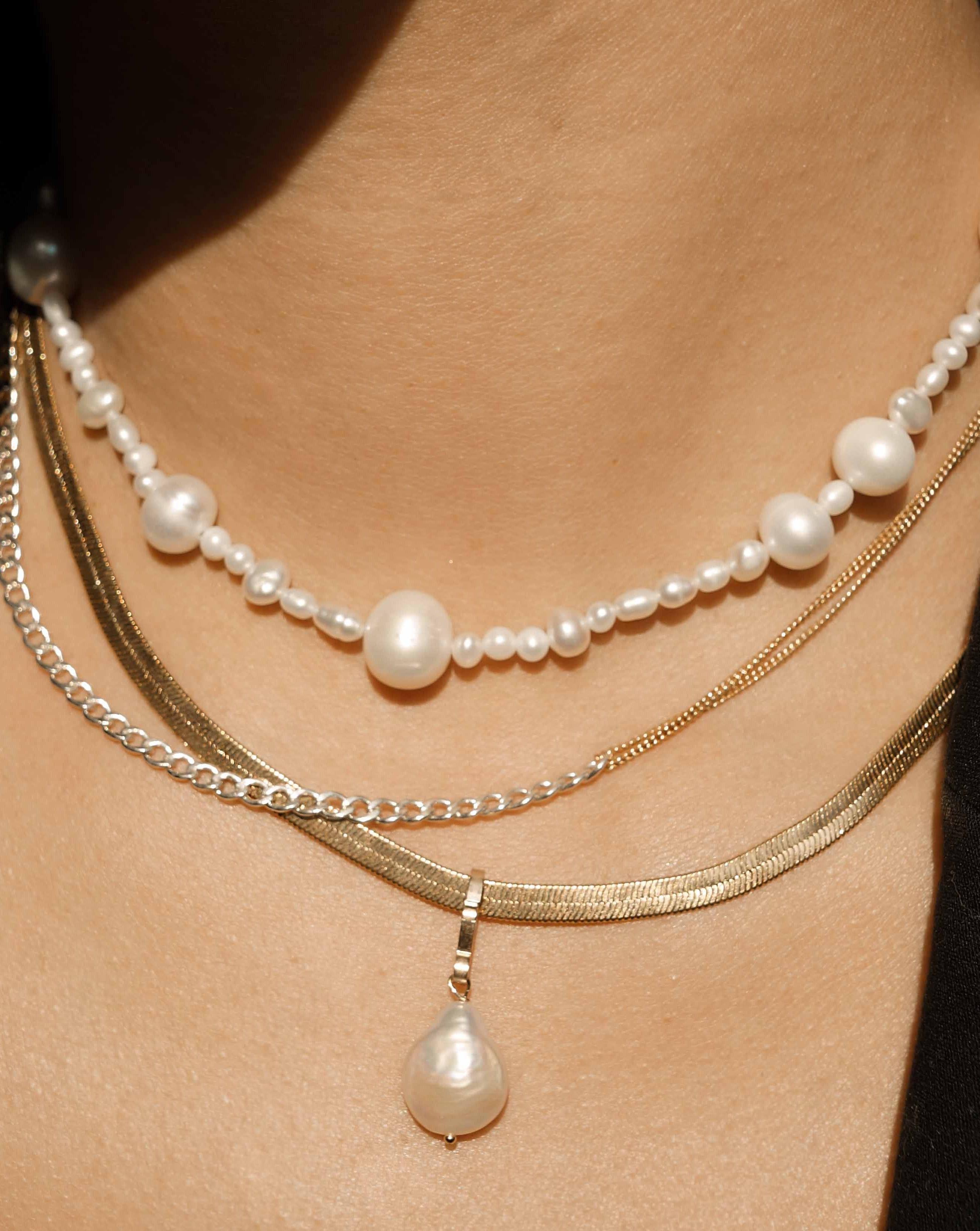 Madelyn Necklace by KOZAKH. A 14 to 16 inch adjustable length necklace with a strand of Freshwater Pearls, with a 14K Gold Filled clasp.