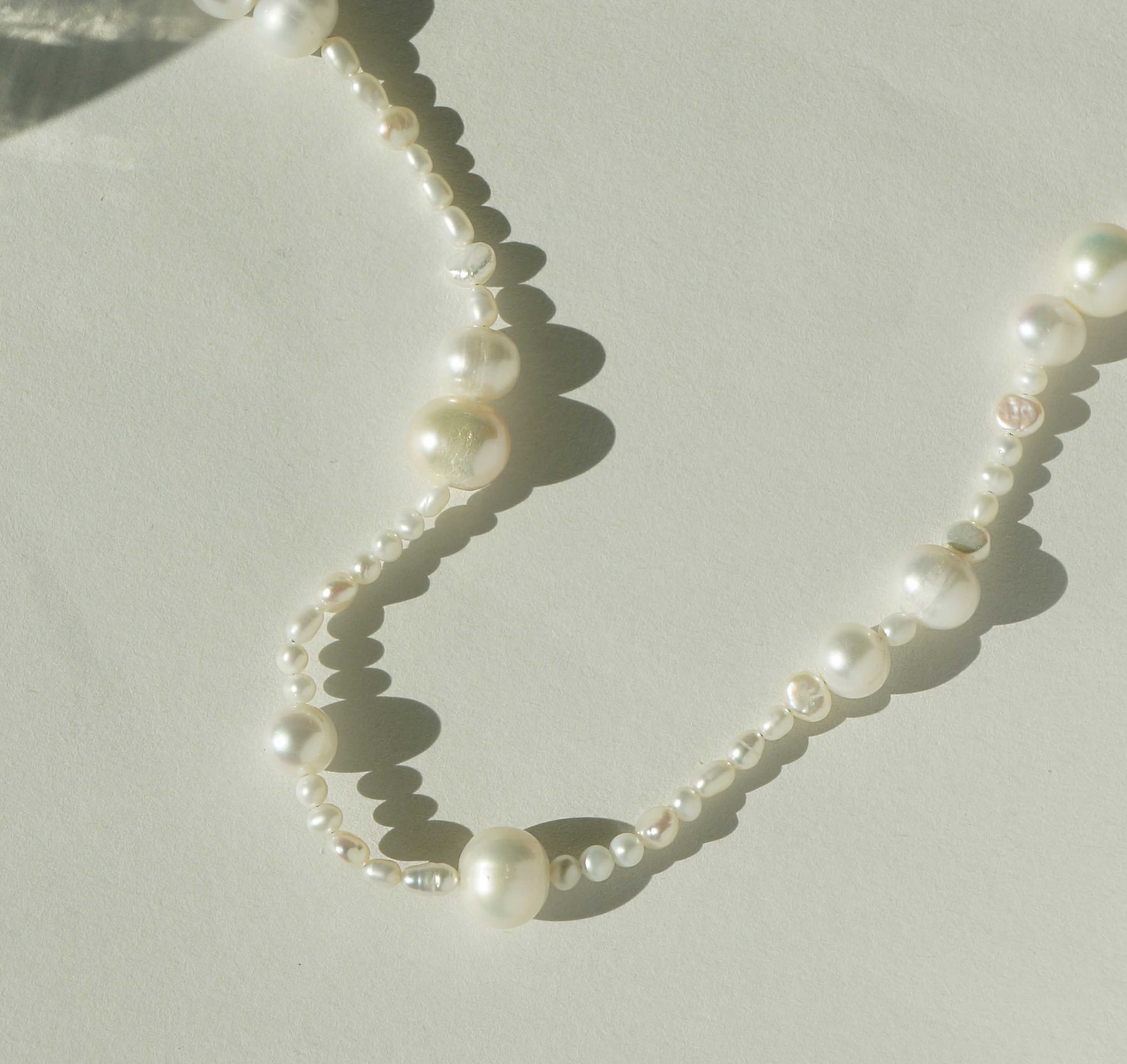 Madelyn Necklace by KOZAKH. A 14 to 16 inch adjustable length necklace with a strand of Freshwater Pearls, with a 14K Gold Filled clasp.