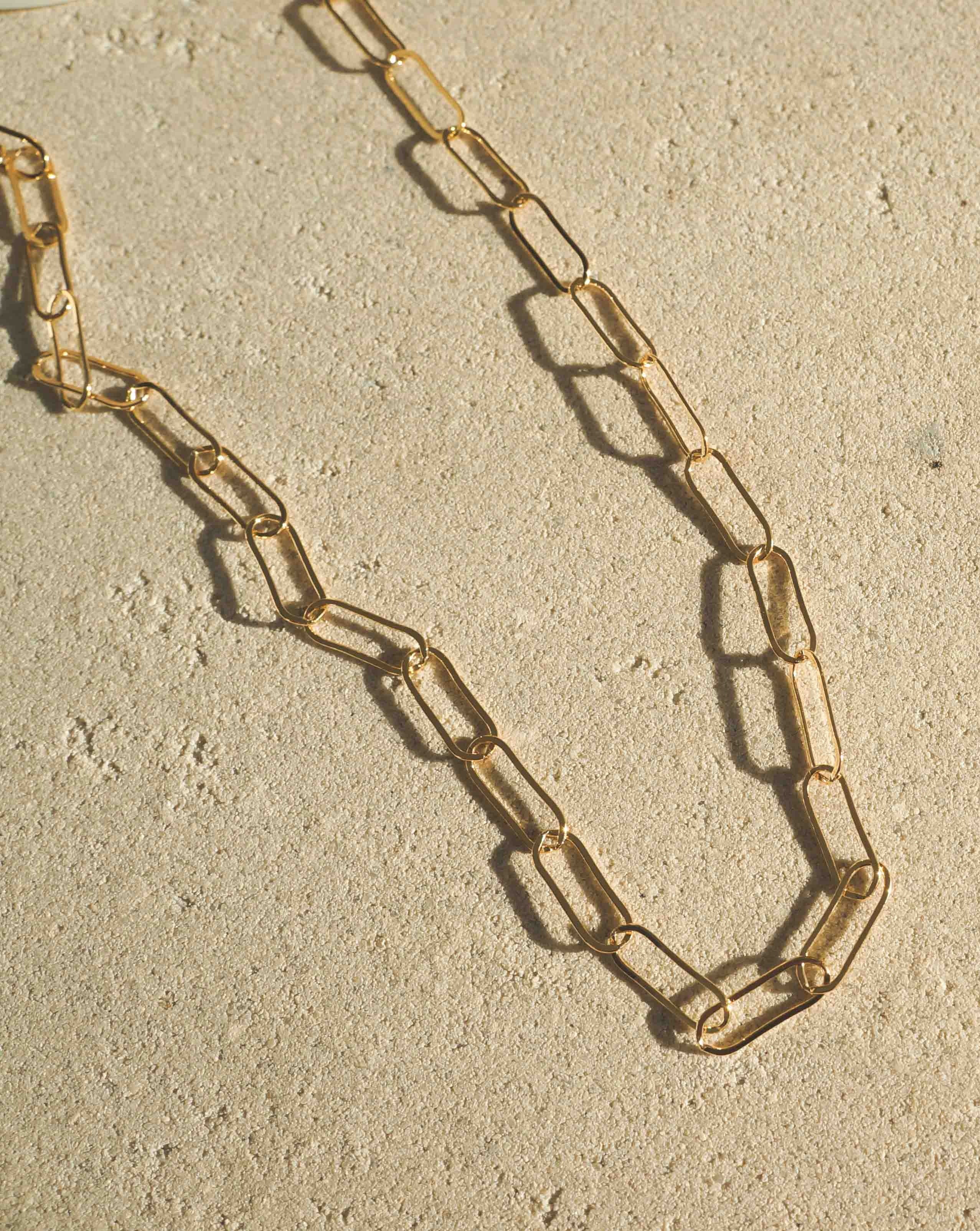 Muse Chain Necklace by KOZAKH. A 14 to 16 inch adjustable length, flat oval link chain necklace, crafted in 14K Gold Filled.