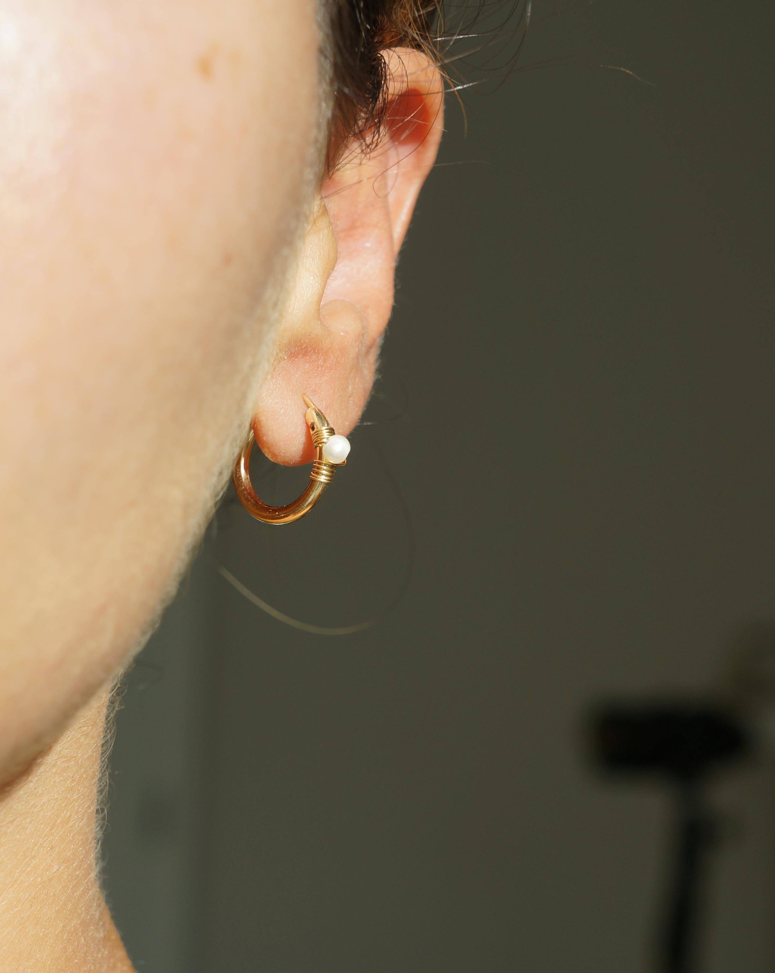 Natalie Earrings by KOZAKH. 12mm snap closure hoop earrings in 14K Gold Filled, featuring a 7mm white potato Pearl.