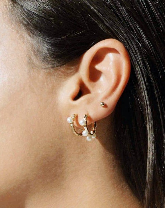 Natalie Earrings by KOZAKH. 12mm snap closure hoop earrings in 14K Gold Filled, featuring a 7mm white potato Pearl.