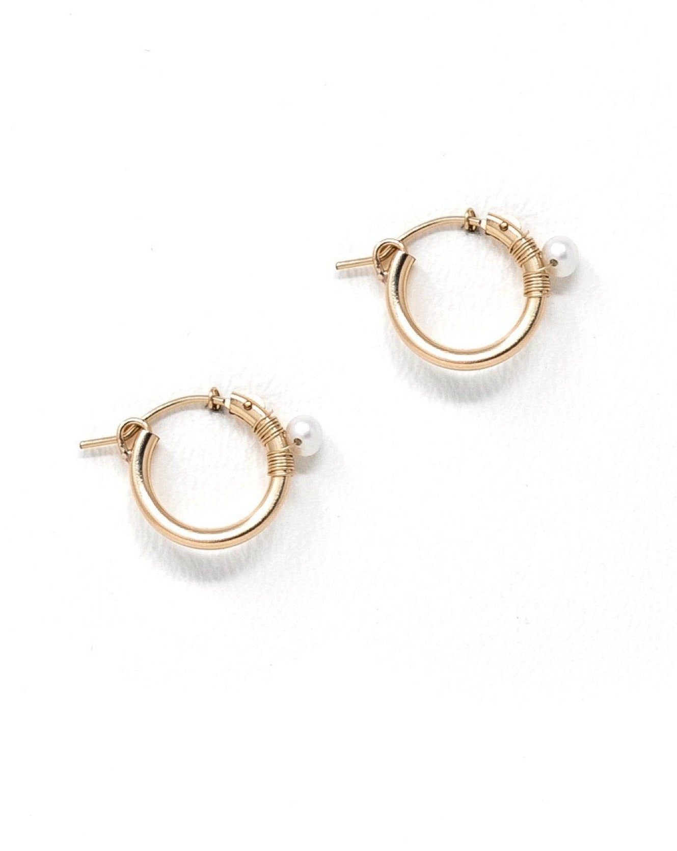 Natalie Earrings by KOZAKH. 12mm snap closure hoop earrings in 14K Gold Filled, featuring a 7mm white potato Pearl.