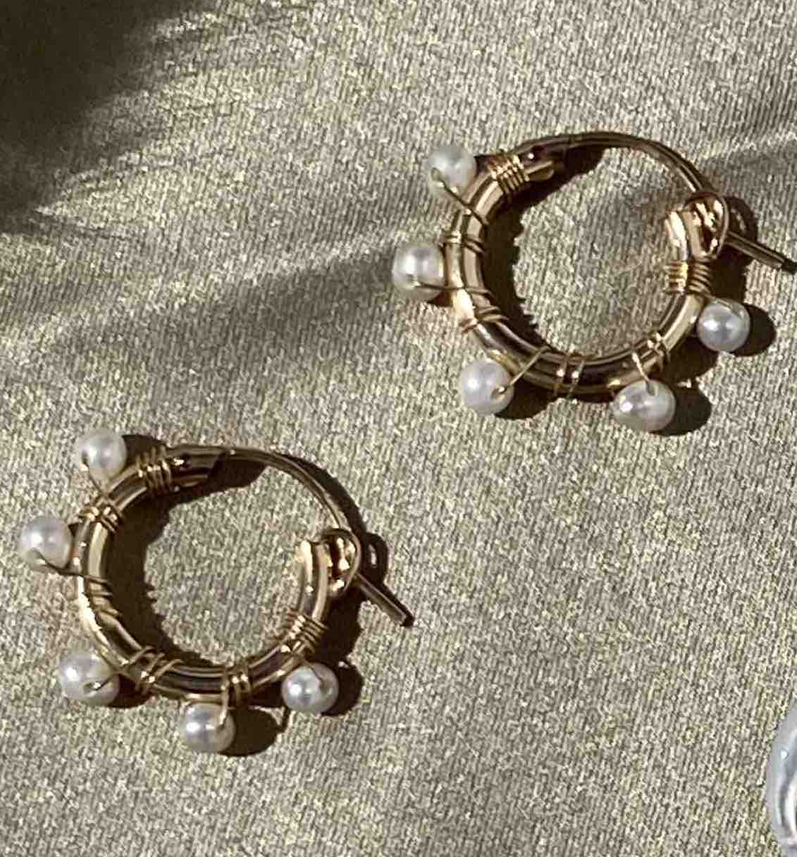 Natasha Hoop Earrings by KOZAKH. 12mm snap closure hoop earrings in 14K Gold Filled, featuring 7mm white potato Pearls.