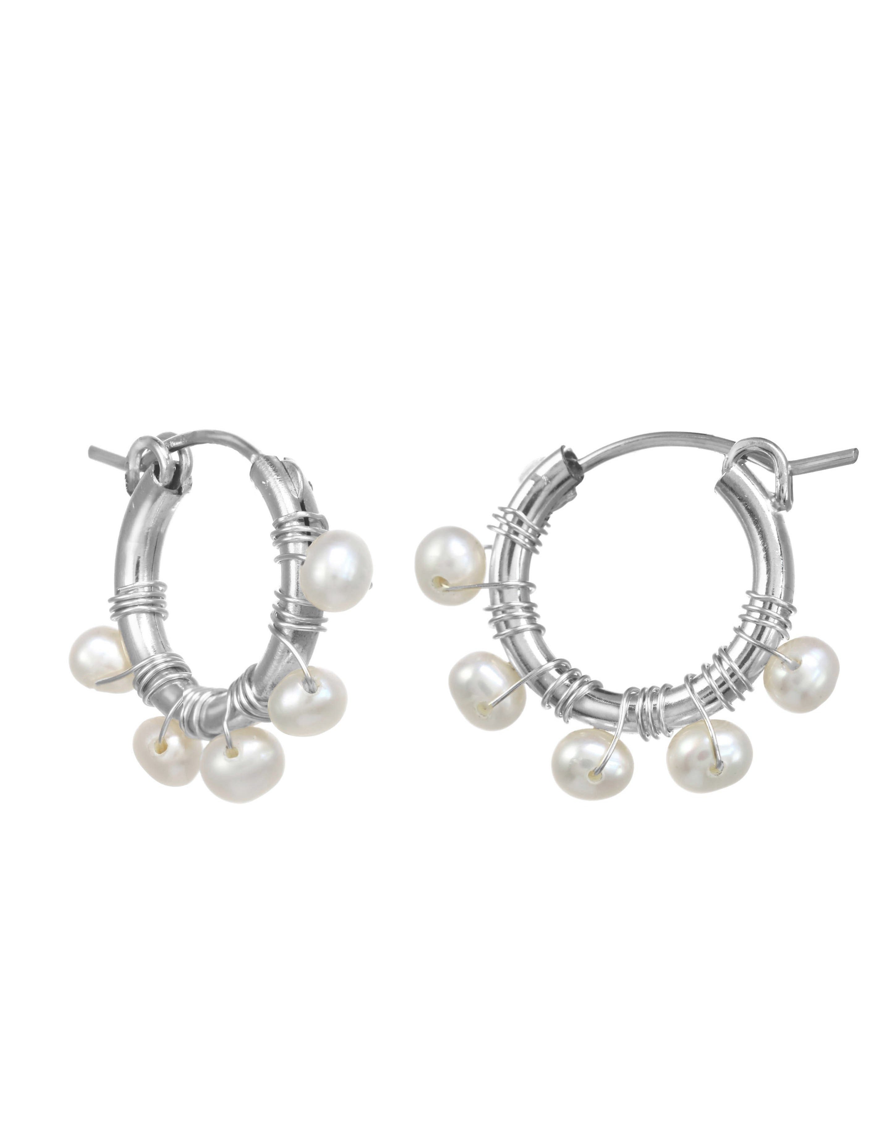 Natasha Hoop Earrings by KOZAKH. 12mm snap closure hoop earrings in Sterling Silver, featuring 7mm white potato Pearls.