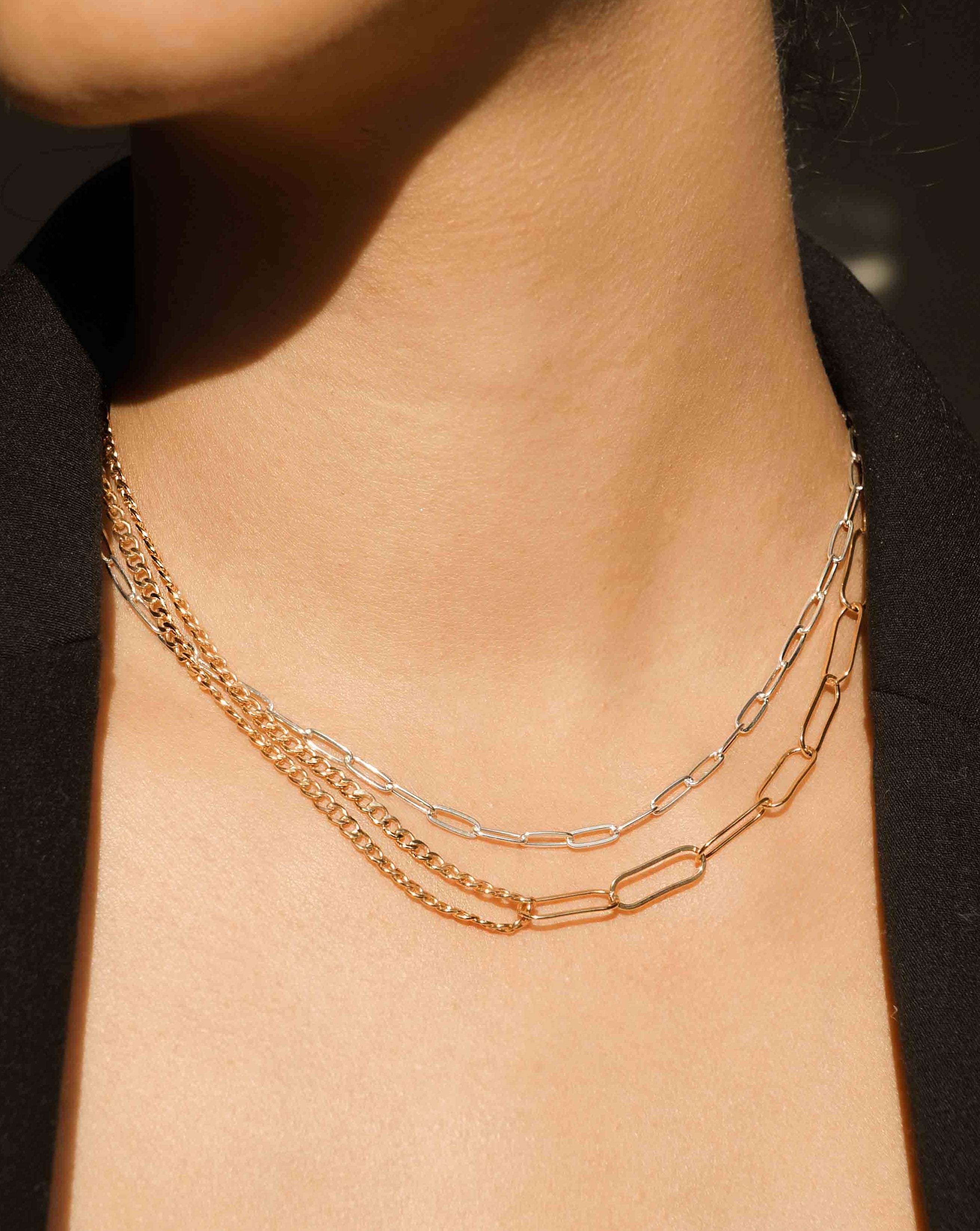 Nora Necklace by KOZAKH. A 14 to 16 inch adjustable length, thin flat link paperclip style chain necklace, crafted in Sterling Silver.