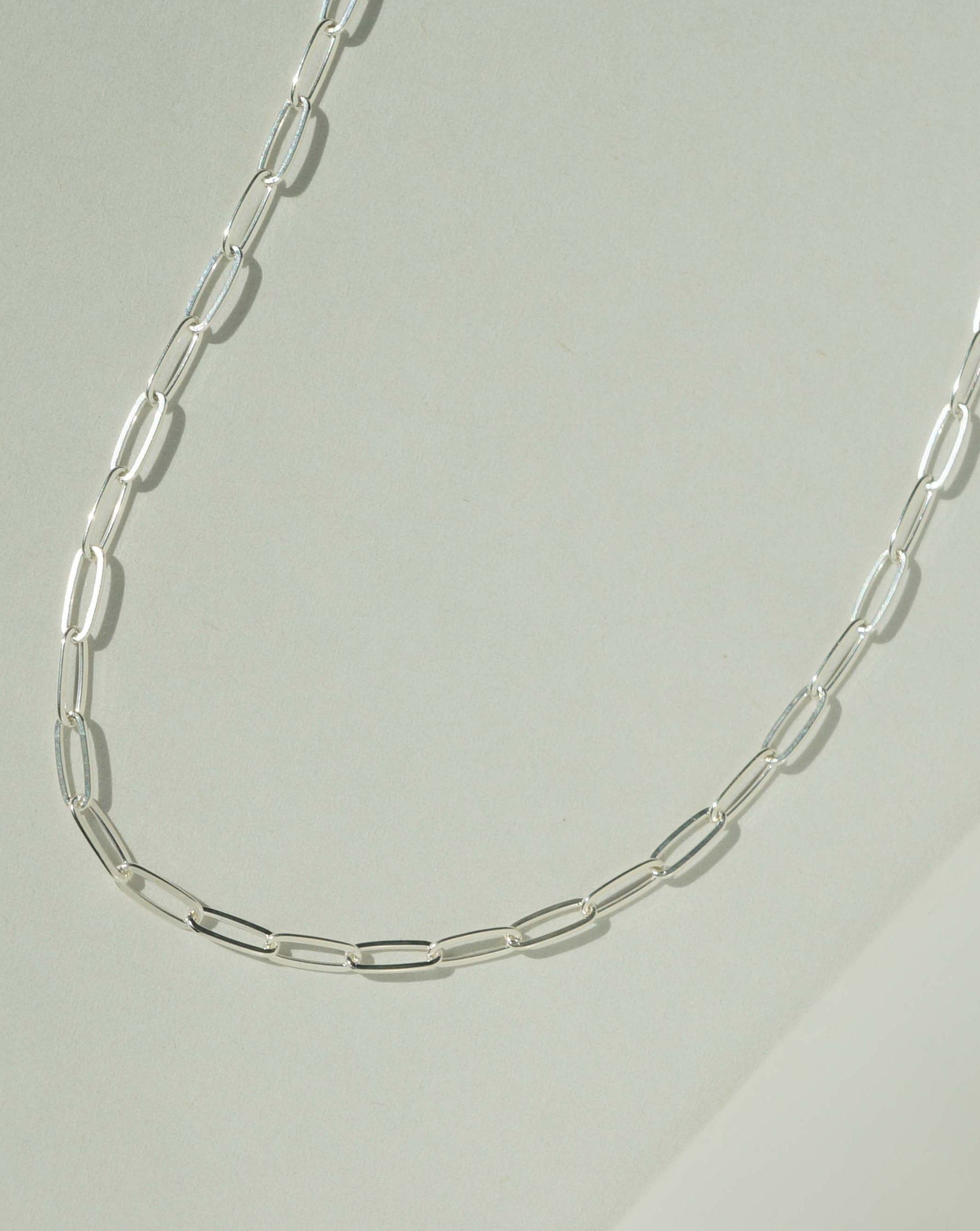 Nora Necklace by KOZAKH. A 14 to 16 inch adjustable length, thin flat link paperclip style chain necklace, crafted in Sterling Silver.