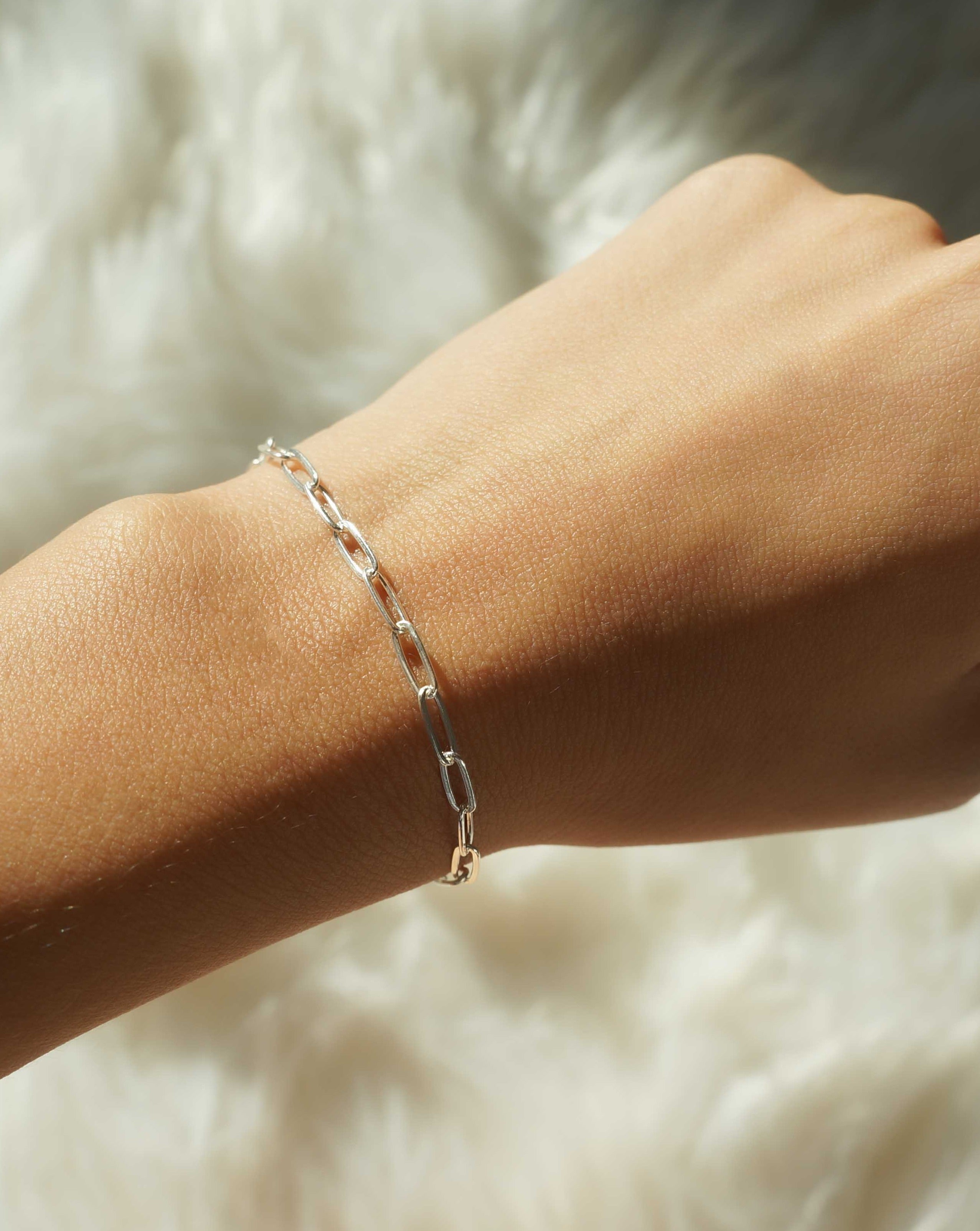 Norita Bracelet by KOZAKH. A 6 to 7 inch adjustable length, thin flat link paperclip style chain bracelet, crafted in Sterling Silver.