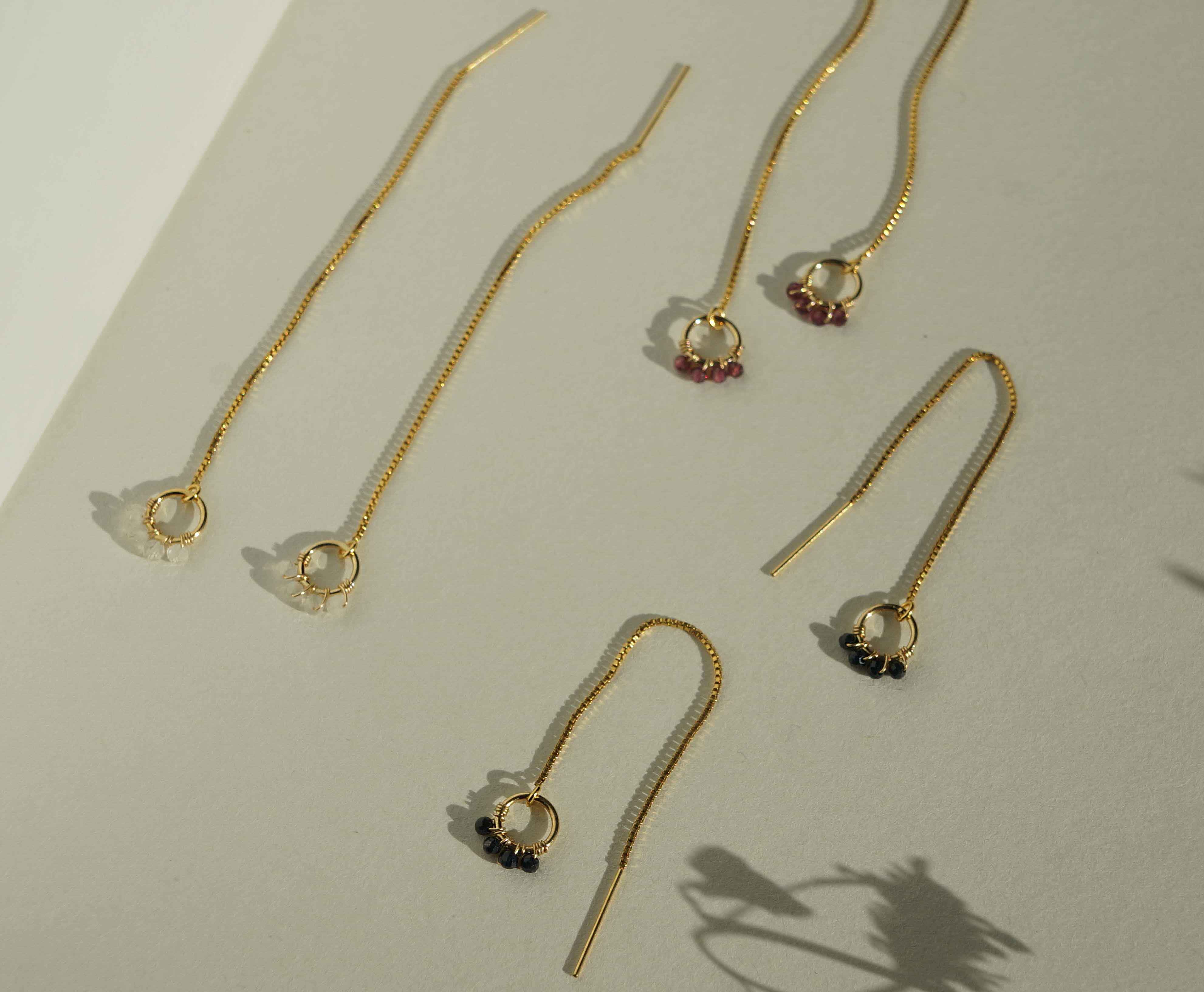 Onda Threader Earrings by KOZAKH. Box chain threader style earrings, crafted in 14K Gold Filled, featuring 2mm faceted gems.