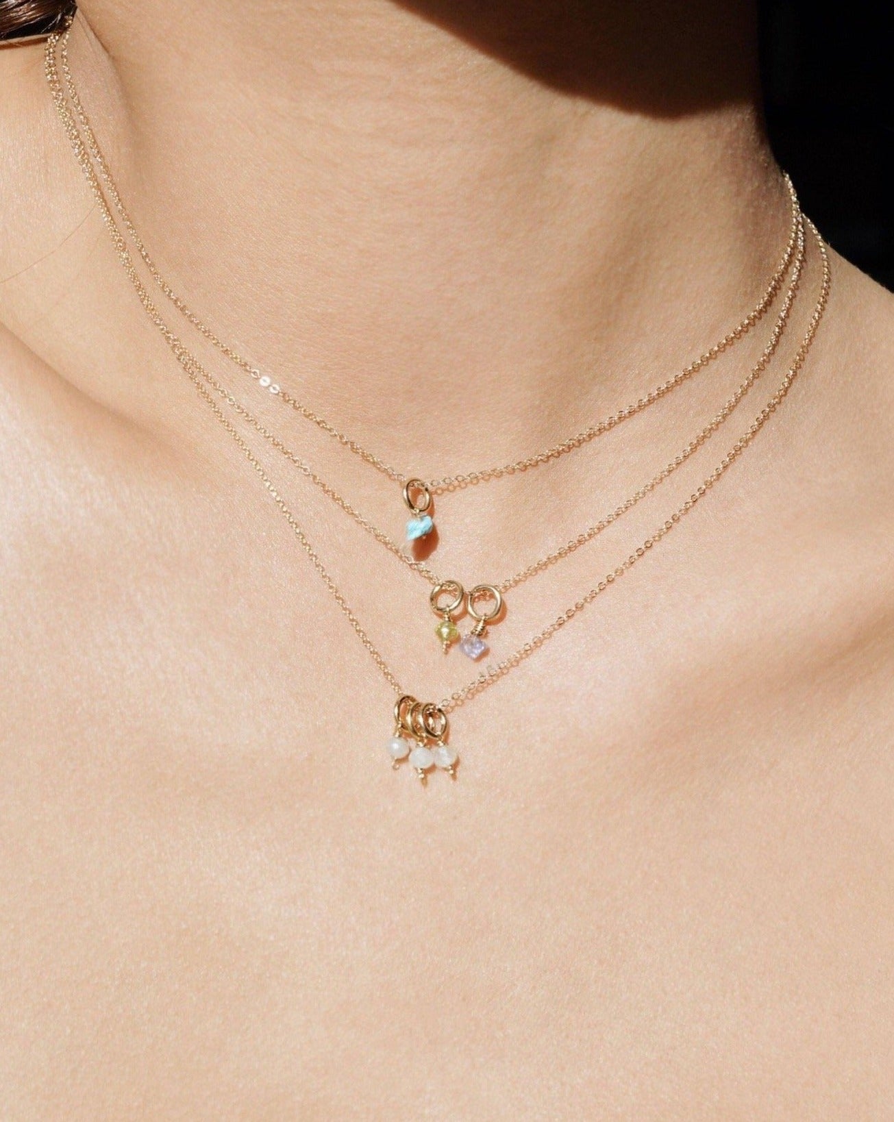 One Love Birthstone Necklace by KOZAKH. A necklace crafted in 14K Gold Filled, featuring customizable Birthstone charms and is available in 4 adjustable lengths.