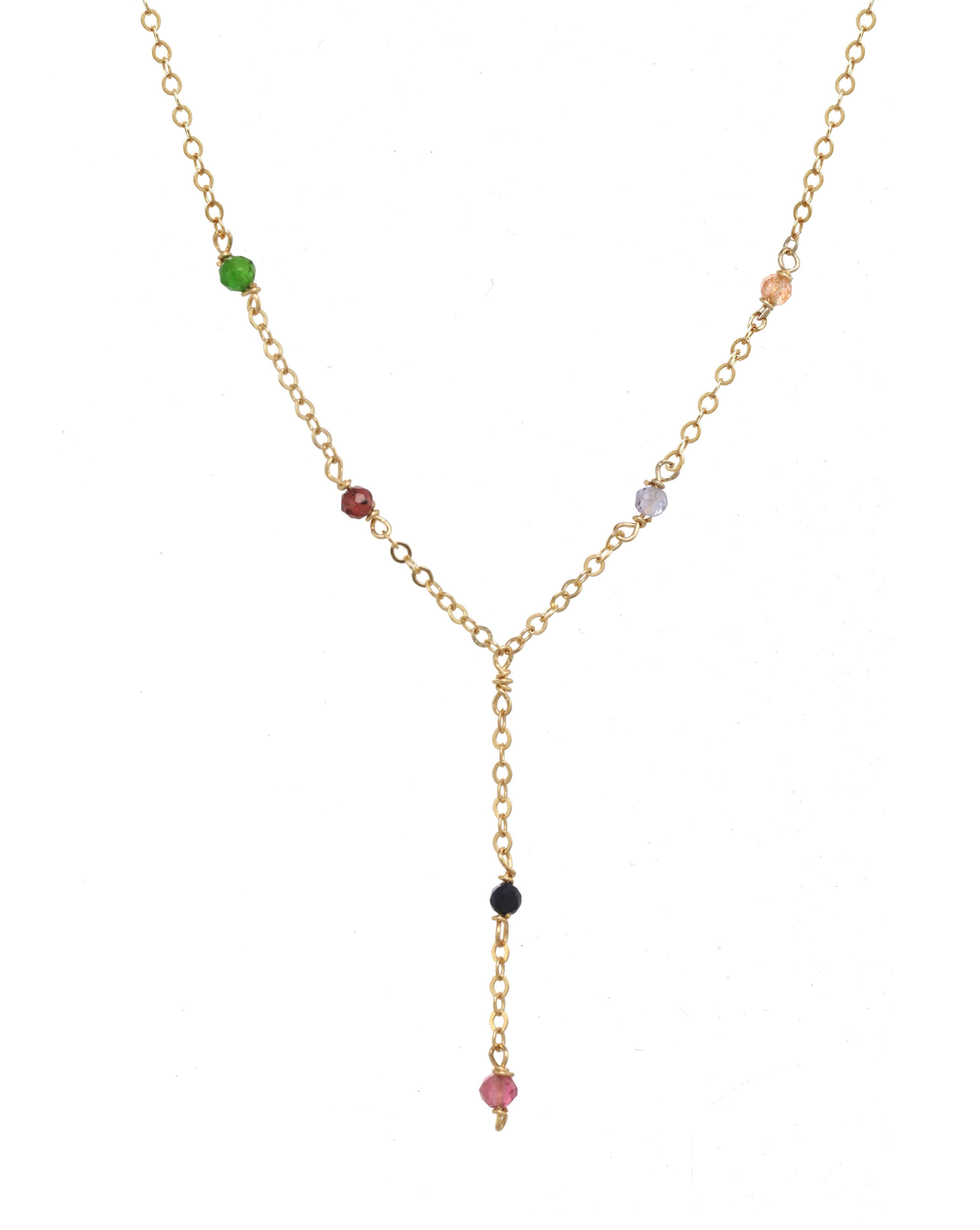 Safron Necklace by KOZAKH. A 16 to 18 inch adjustable length, lariat style necklace, crafted in 14K Gold Filled, featuring 2mm Faceted round Emerald, Garnet, Sapphire, Tourmaline, Tanzanite and Topaz.