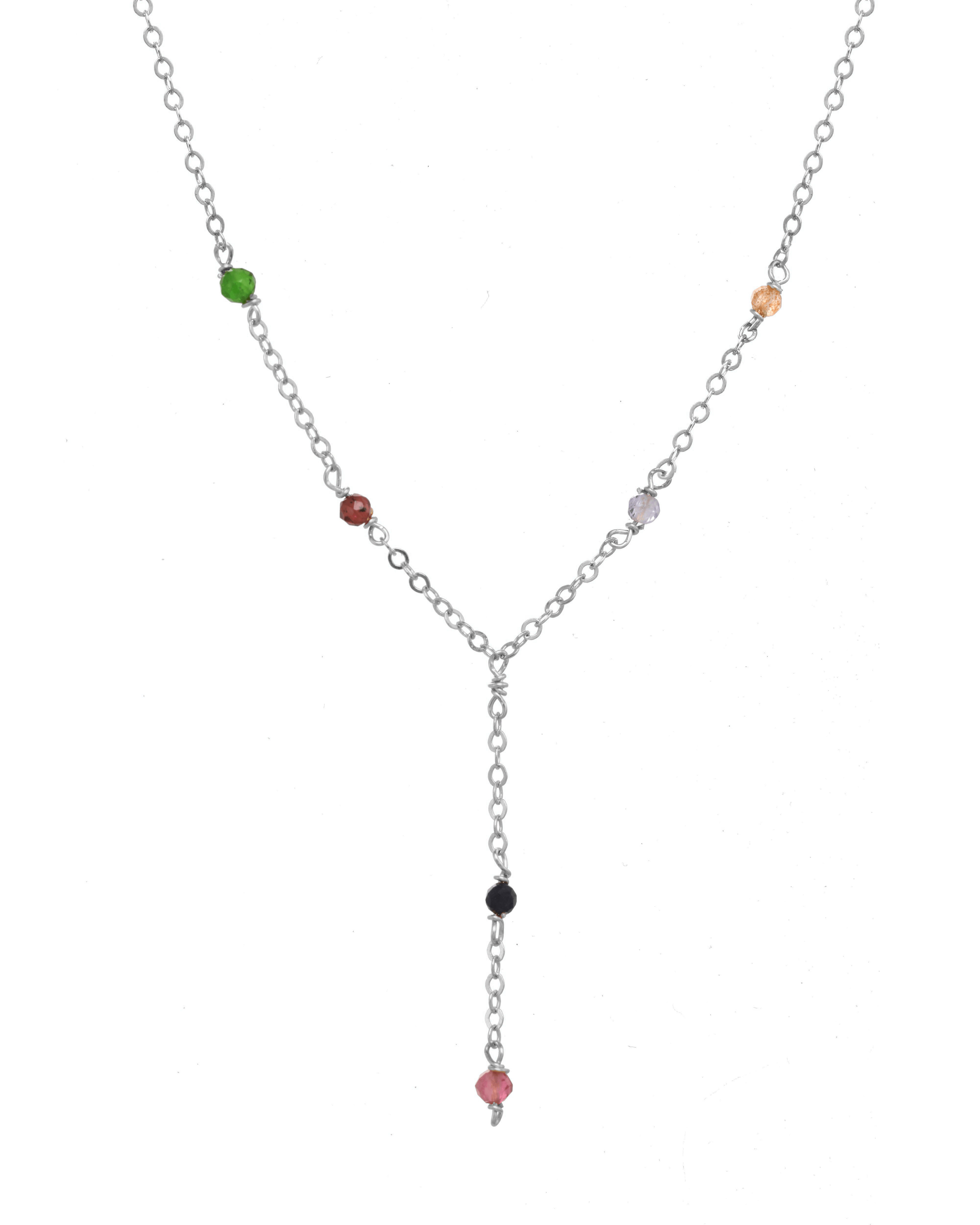 Safron Necklace by KOZAKH. A 16 to 18 inch adjustable length, lariat style necklace, crafted in Sterling Silver, featuring 2mm Faceted round Emerald, Garnet, Sapphire, Tourmaline, Tanzanite and Topaz.