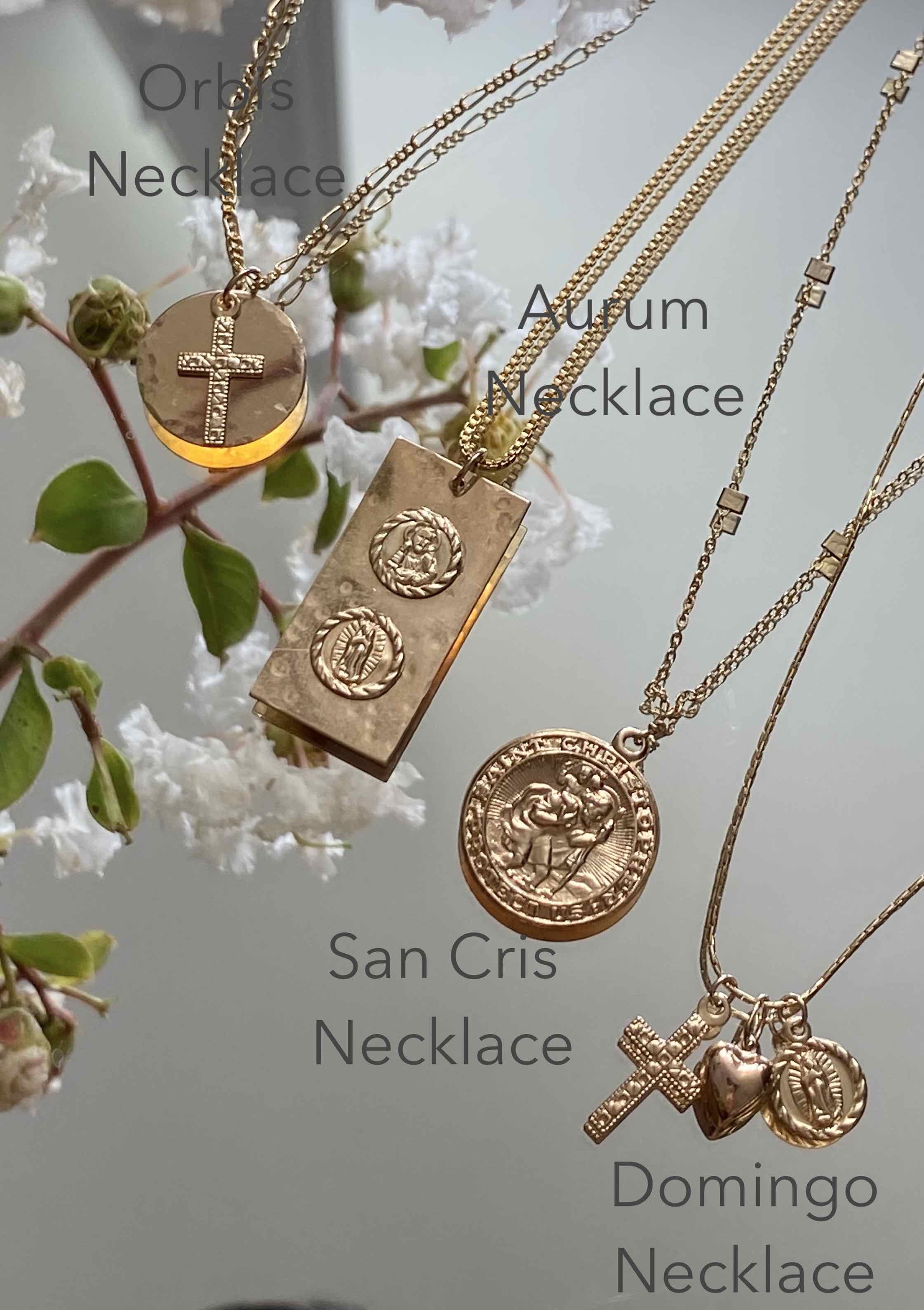 San Cris Necklace by KOZAKH. A 16 to 18 inch adjustable length necklace, crafted in 14K Gold Filled, featuring a 16mm Saint Christopher Medallion.