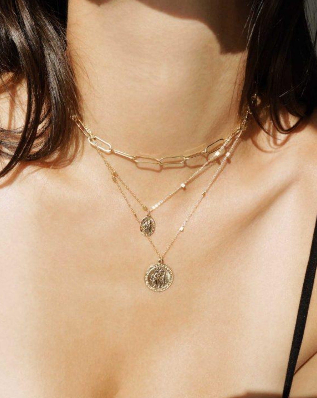 San Cris Necklace by KOZAKH. A 16 to 18 inch adjustable length necklace, crafted in 14K Gold Filled, featuring a 16mm Saint Christopher Medallion.