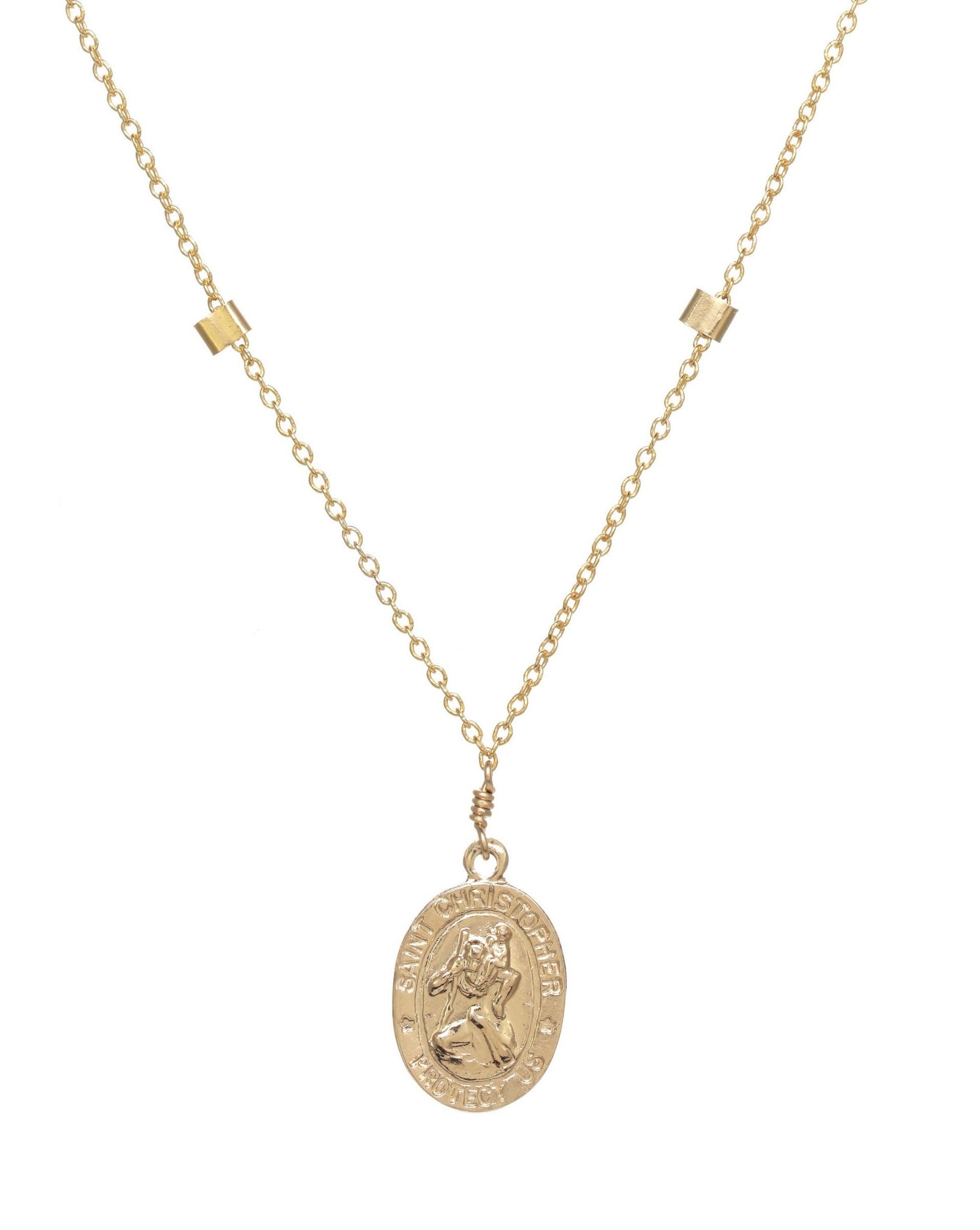 San Cris Oval Necklace by KOZAKH. A 16 to 18 inch adjustable length necklace, crafted in 14K Gold Filled, featuring a 16mm Saint Christopher oval Medallion.