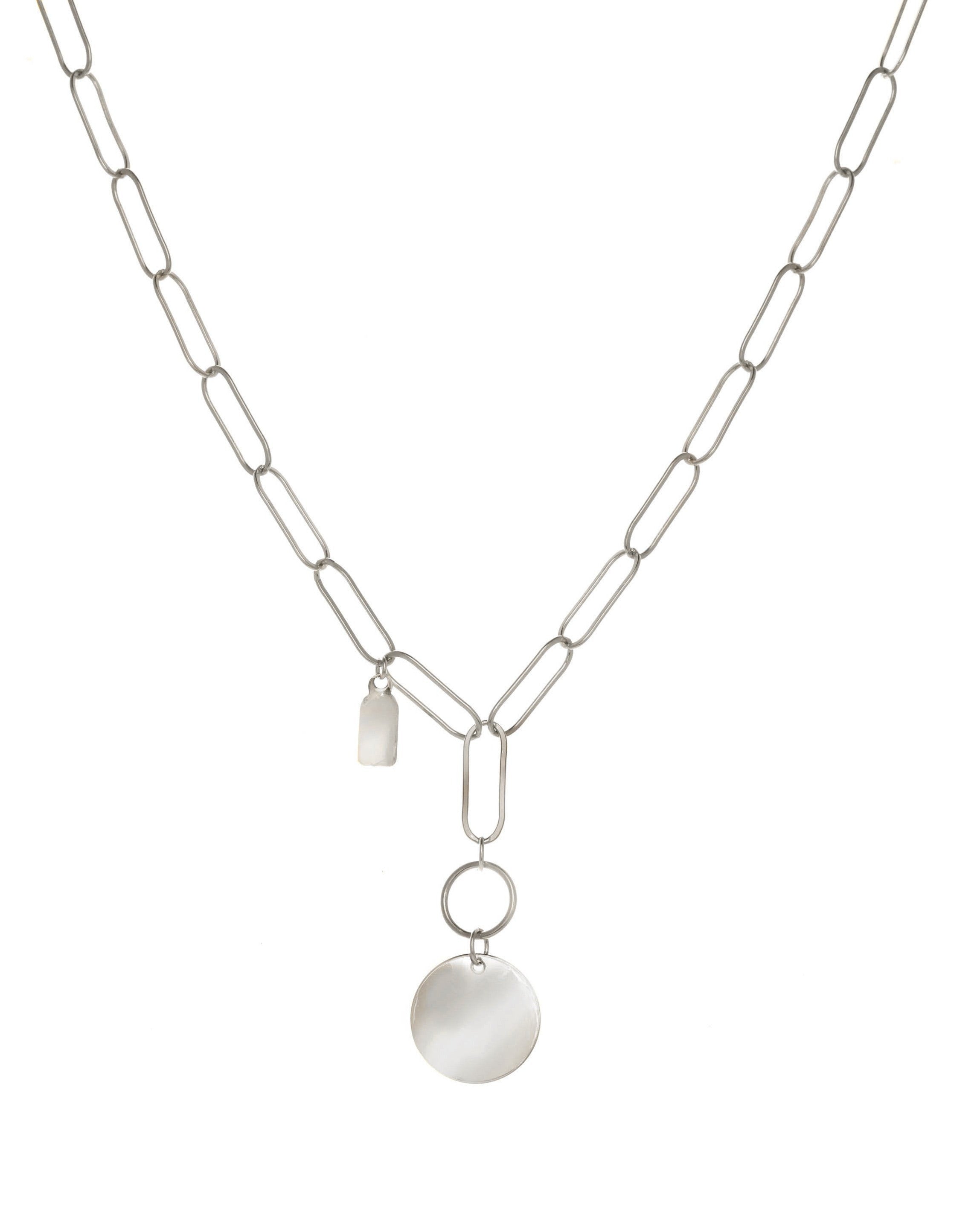 Scarlett Necklace by KOZAKH. A 16 to 18 inch adjustable length, flat oval chain necklace, crafted in Sterling Silver, featuring a 3x5mm Tag and a 16mm Flat coin.