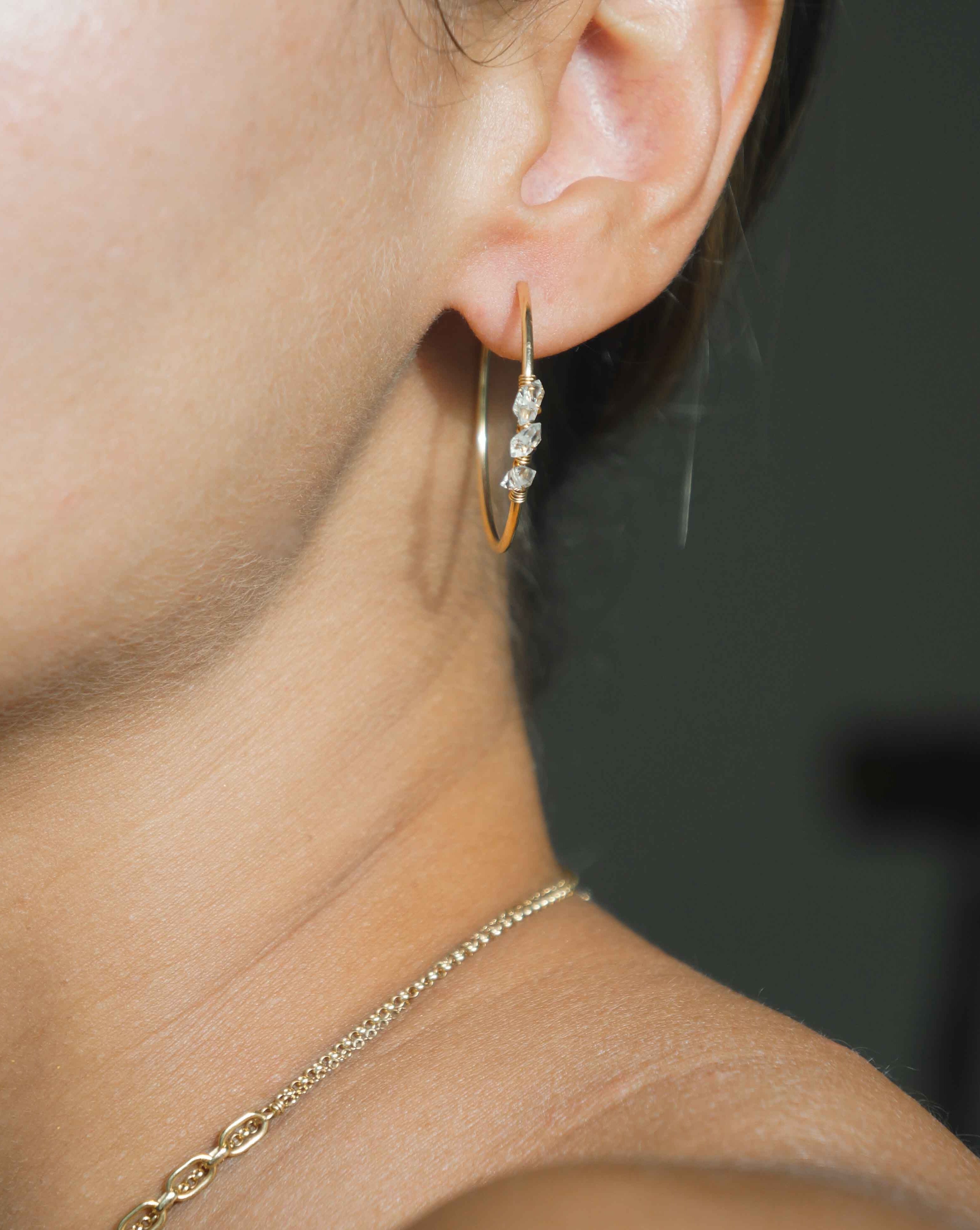 Selena Herkimer Hoop Earrings by KOZAKH. 30mm hoop earrings in 14K Gold Filled, featuring Herkimer Diamonds.