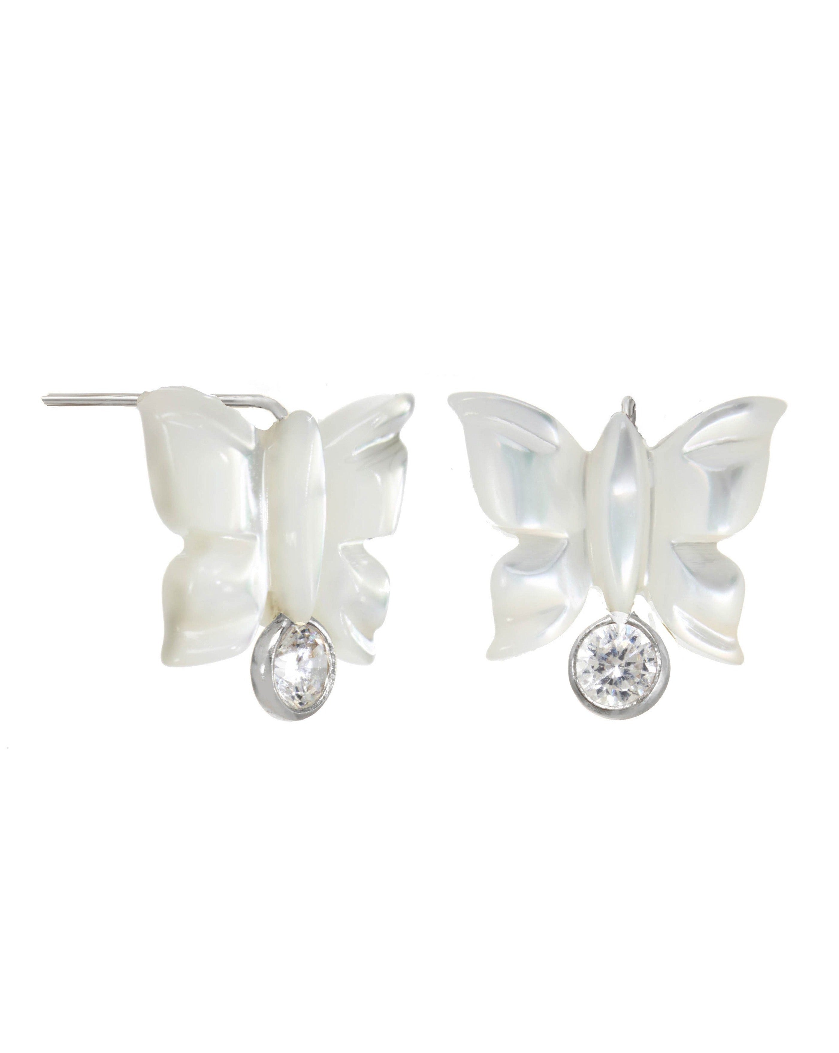 Sevyn Earrings by KOZAKH. Stud earrings, crafted in Sterling Silver, featuring a hand carved butterfly charm and a bezel set Cubic Zirconia.