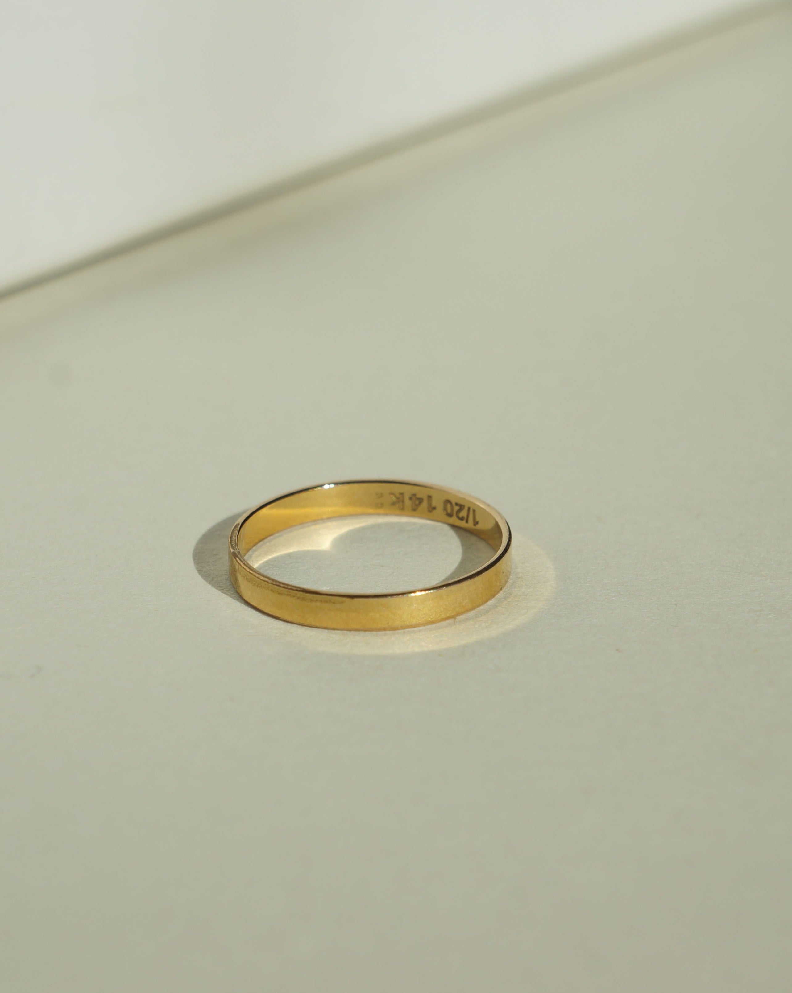Thin Ring by KOZAKH. A 2mm flat ring, crafted in 14K Gold Filled.