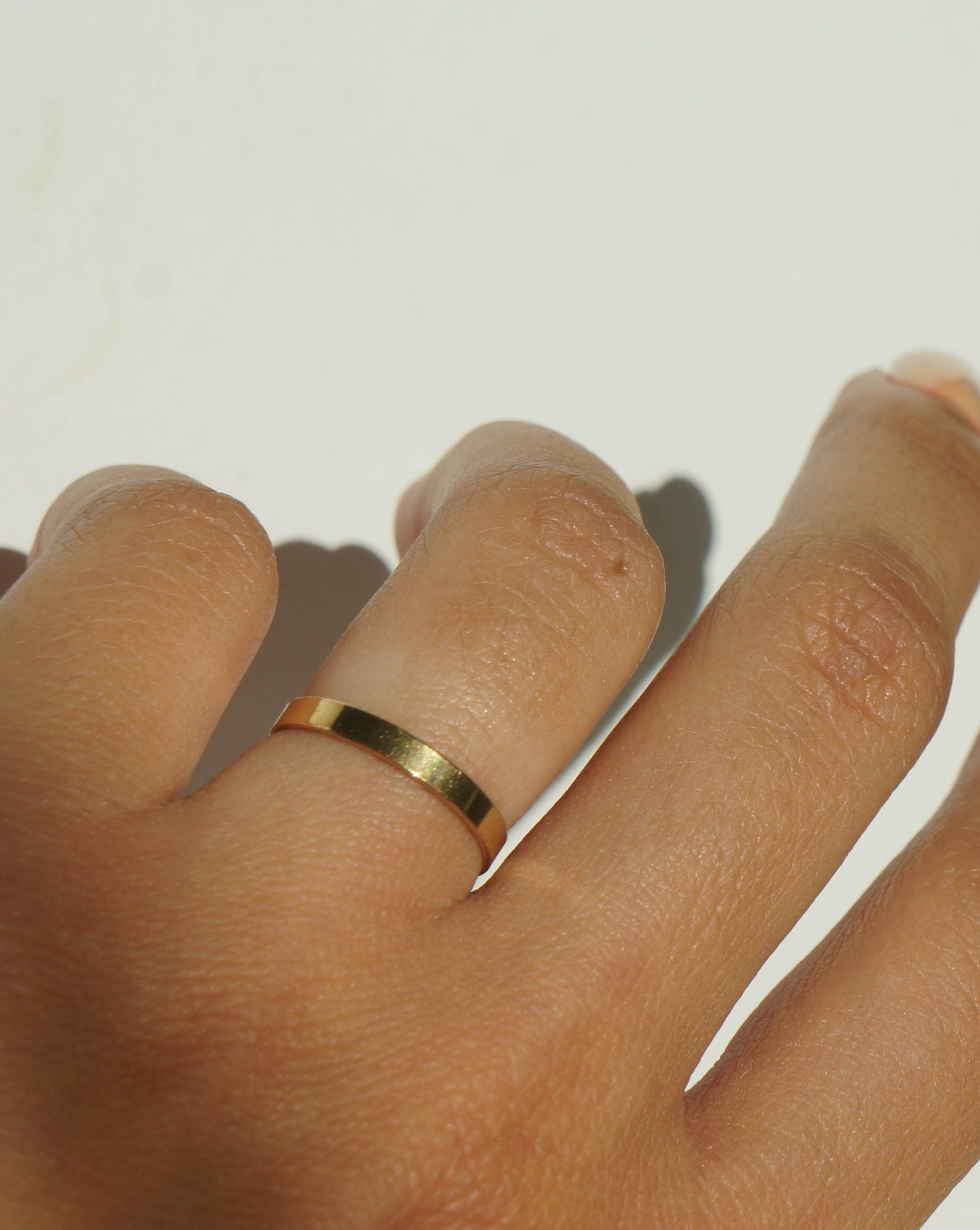 Thin Ring by KOZAKH. A 2mm flat ring, crafted in 14K Gold Filled.