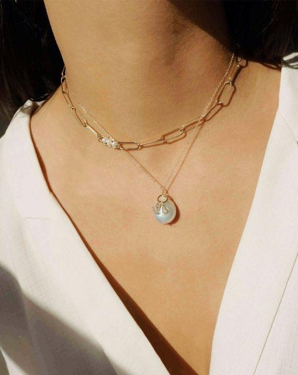 Vanessa Necklace by KOZAKH. A 14 to 16 inch adjustable length, flat link chain necklace, crafted in 14K Gold Filled, featuring 3mm to 4mm white pearls.