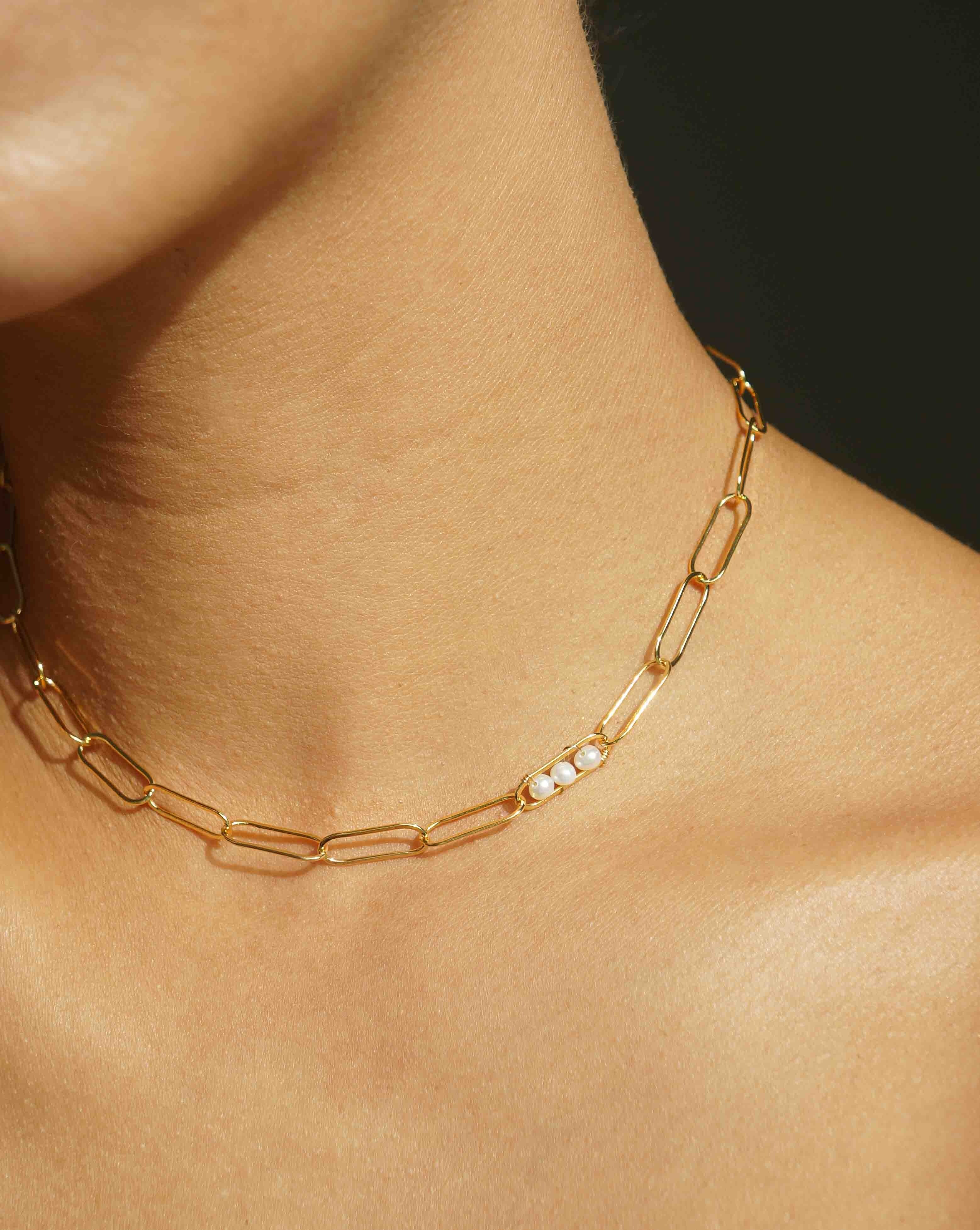 Vanessa Necklace by KOZAKH. A 14 to 16 inch adjustable length, flat link chain necklace, crafted in 14K Gold Filled, featuring 3mm to 4mm white pearls.