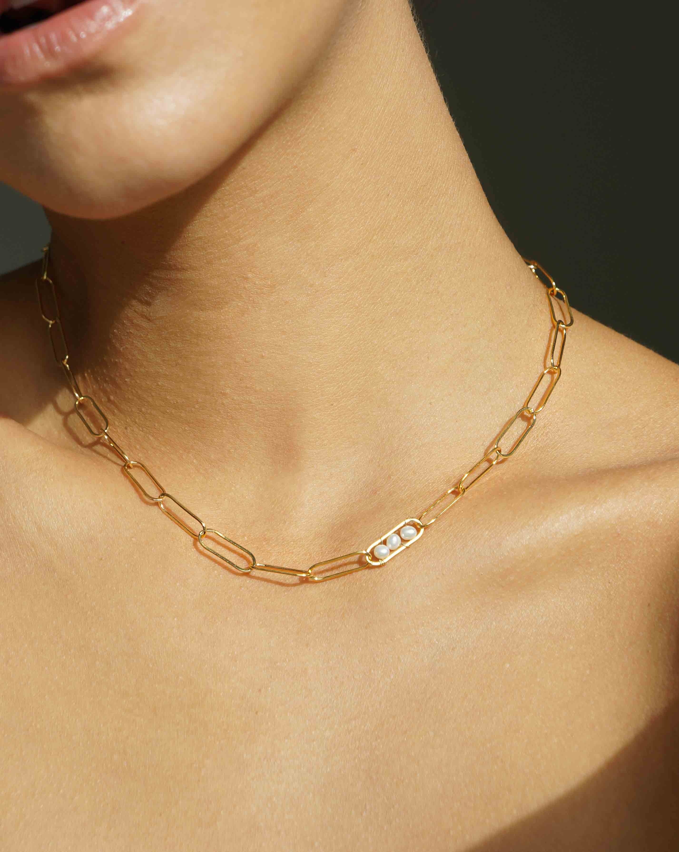 Vanessa Necklace by KOZAKH. A 14 to 16 inch adjustable length, flat link chain necklace, crafted in 14K Gold Filled, featuring 3mm to 4mm white pearls.