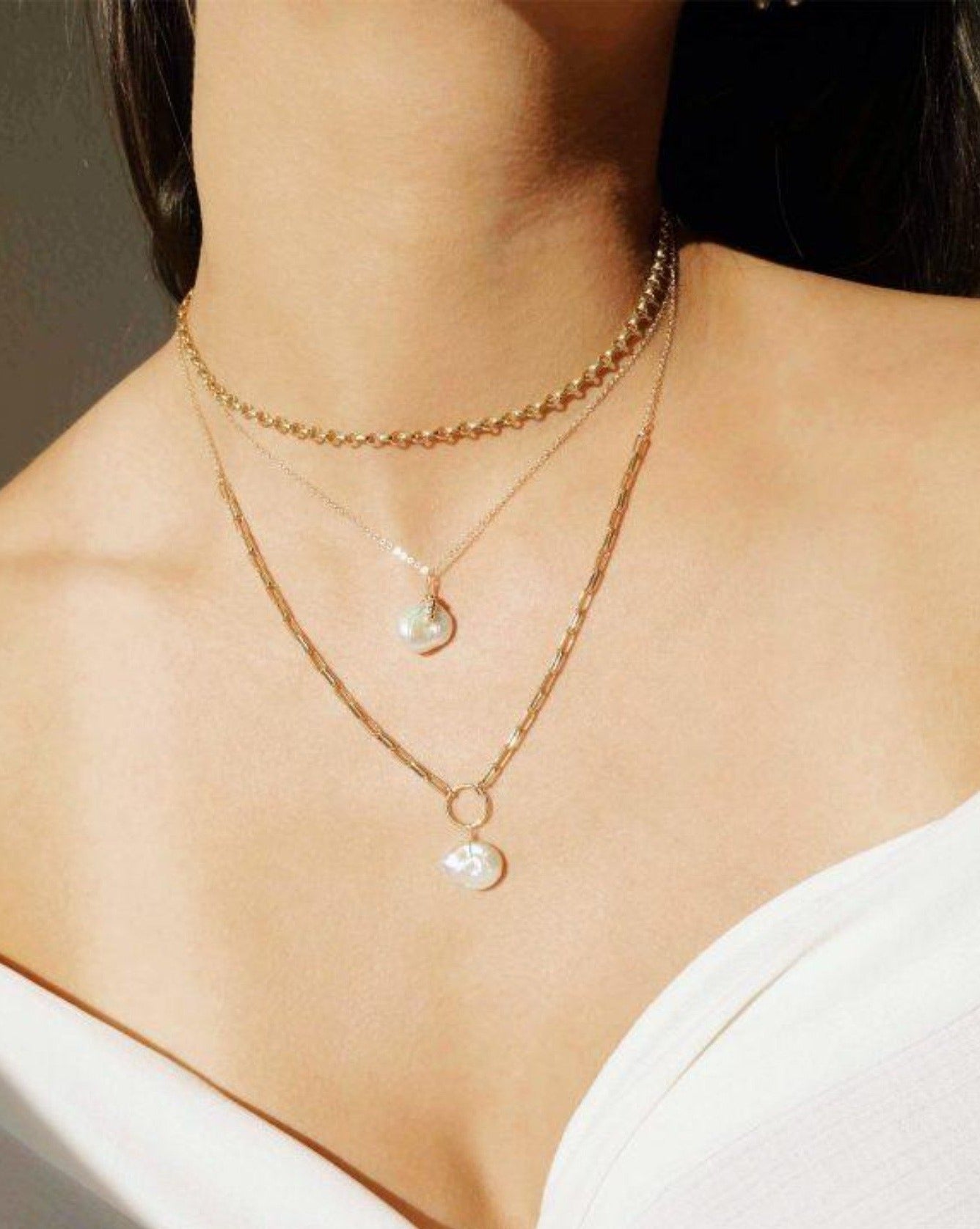 Vivian Necklace by KOZAKH. A 16 to 18 inch adjustable length necklace, crafted in 14K Gold Filled, featuring a Keshi White pearl.