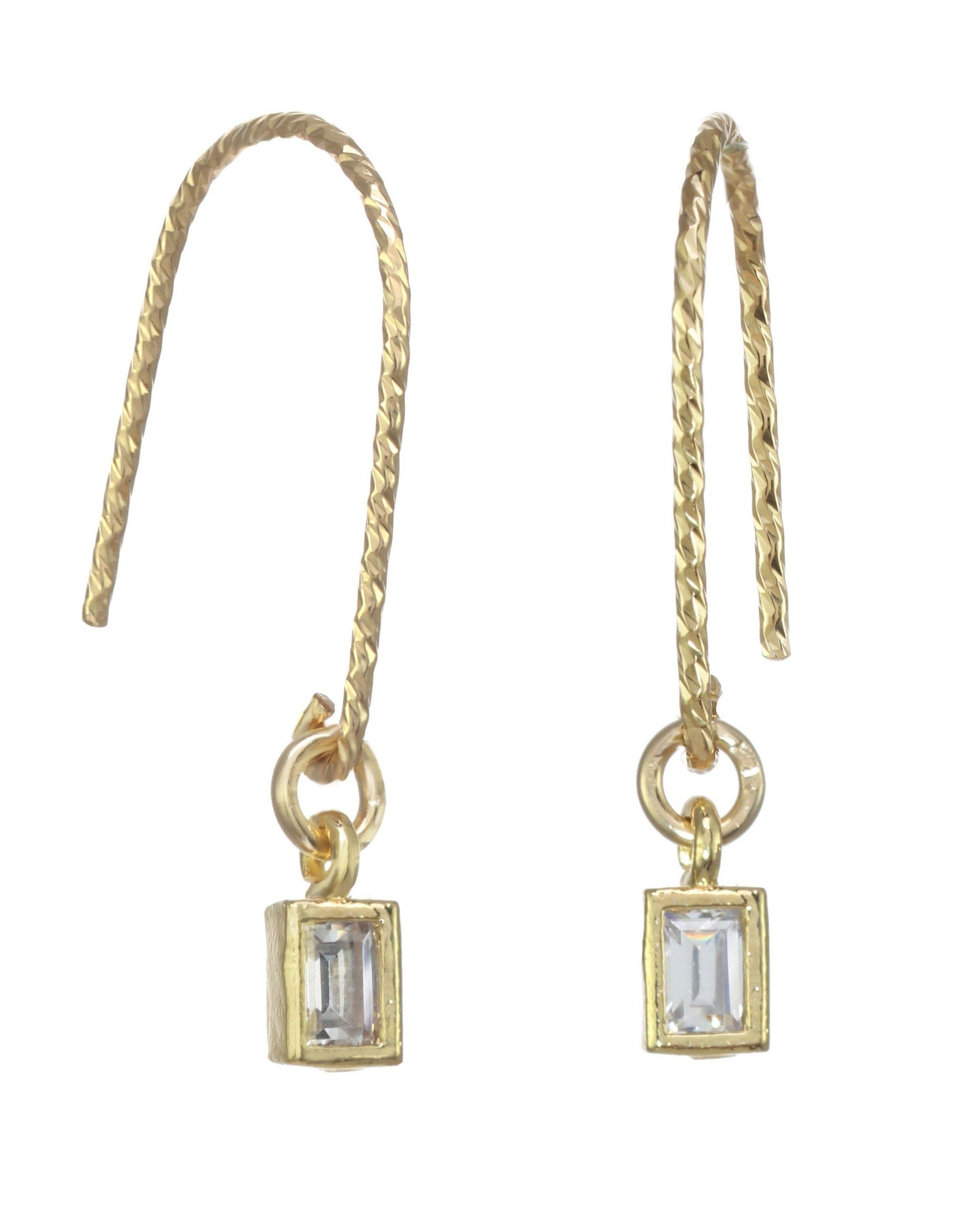 You Cadre Earrings by KOZAKH. Diamond textured hook earrings, crafted in 14K Gold Filled, featuring a CUbic Zirconia charm.