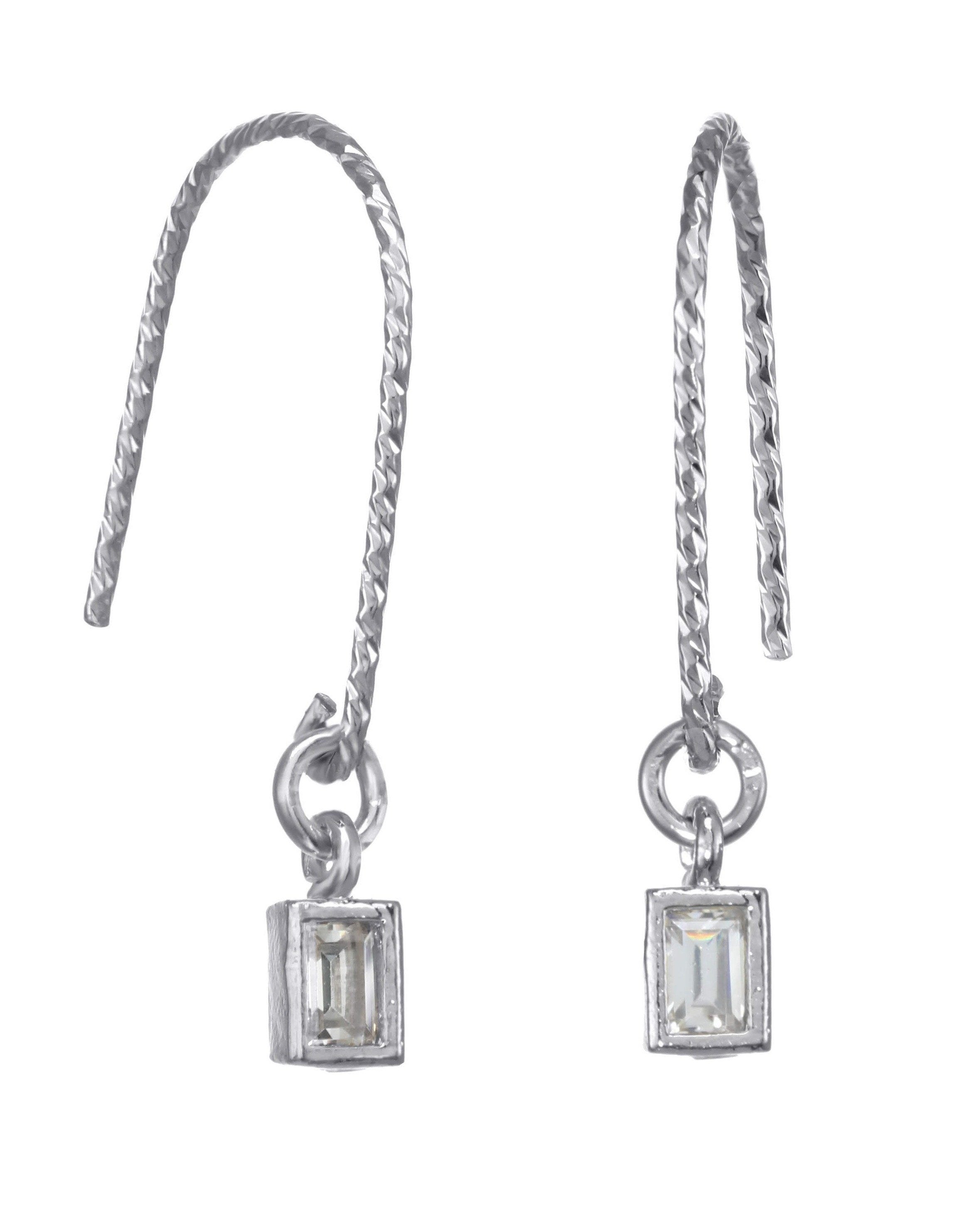 You Cadre Earrings by KOZAKH. Diamond textured hook earrings, crafted in Sterling Silver, featuring a CUbic Zirconia charm.