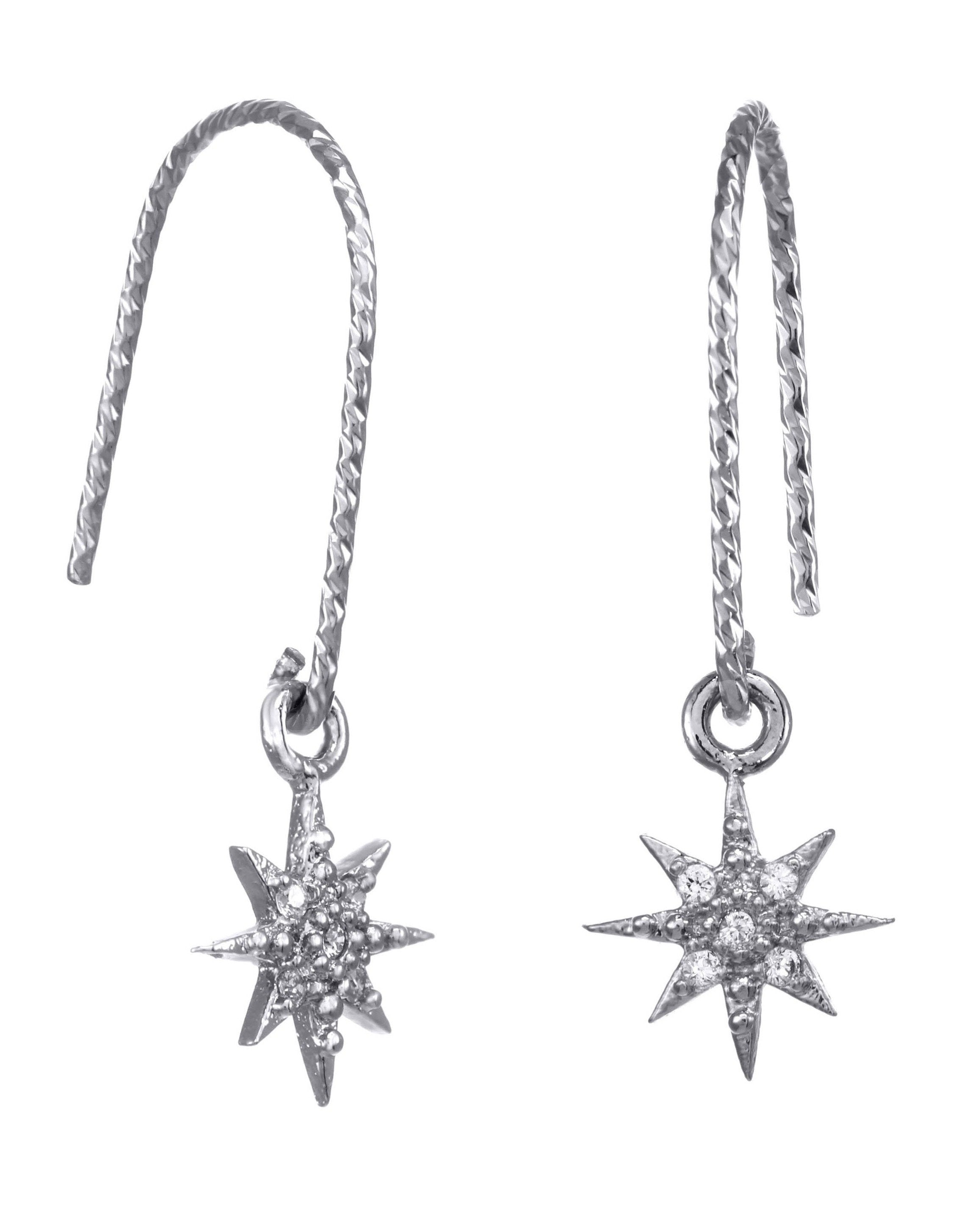 You Star Earrings by KOZAKH. Diamond textured hook earrings, crafted in Sterling Silver, featuring a Cubic Zirconia encrusted 8 point star charm.