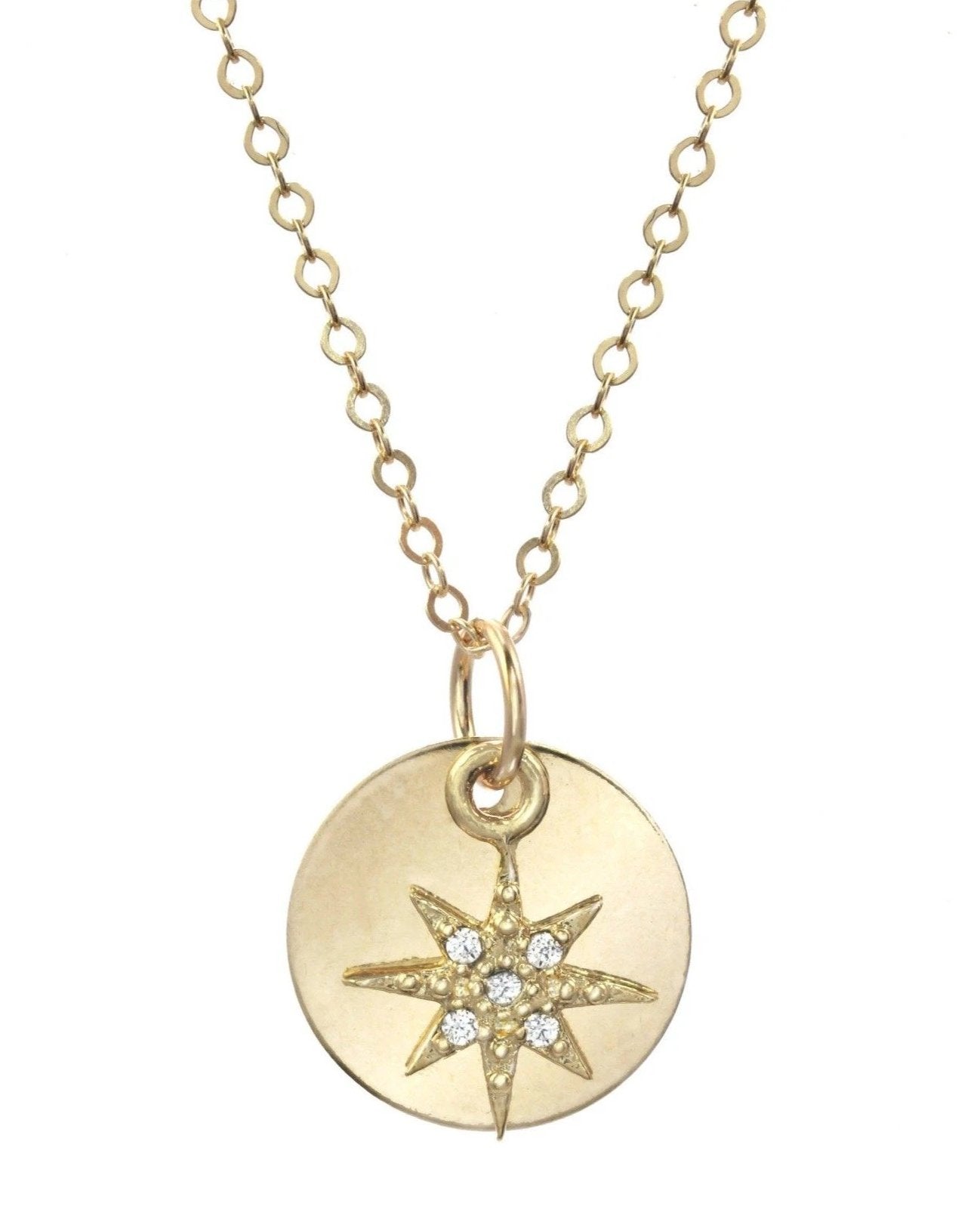 Adeena Necklace by KOZAKH. A 16 to 18 inch adjustable length necklace in 14K Gold Filled, featuring a coin charm and a Cubic Zirconia star charm.