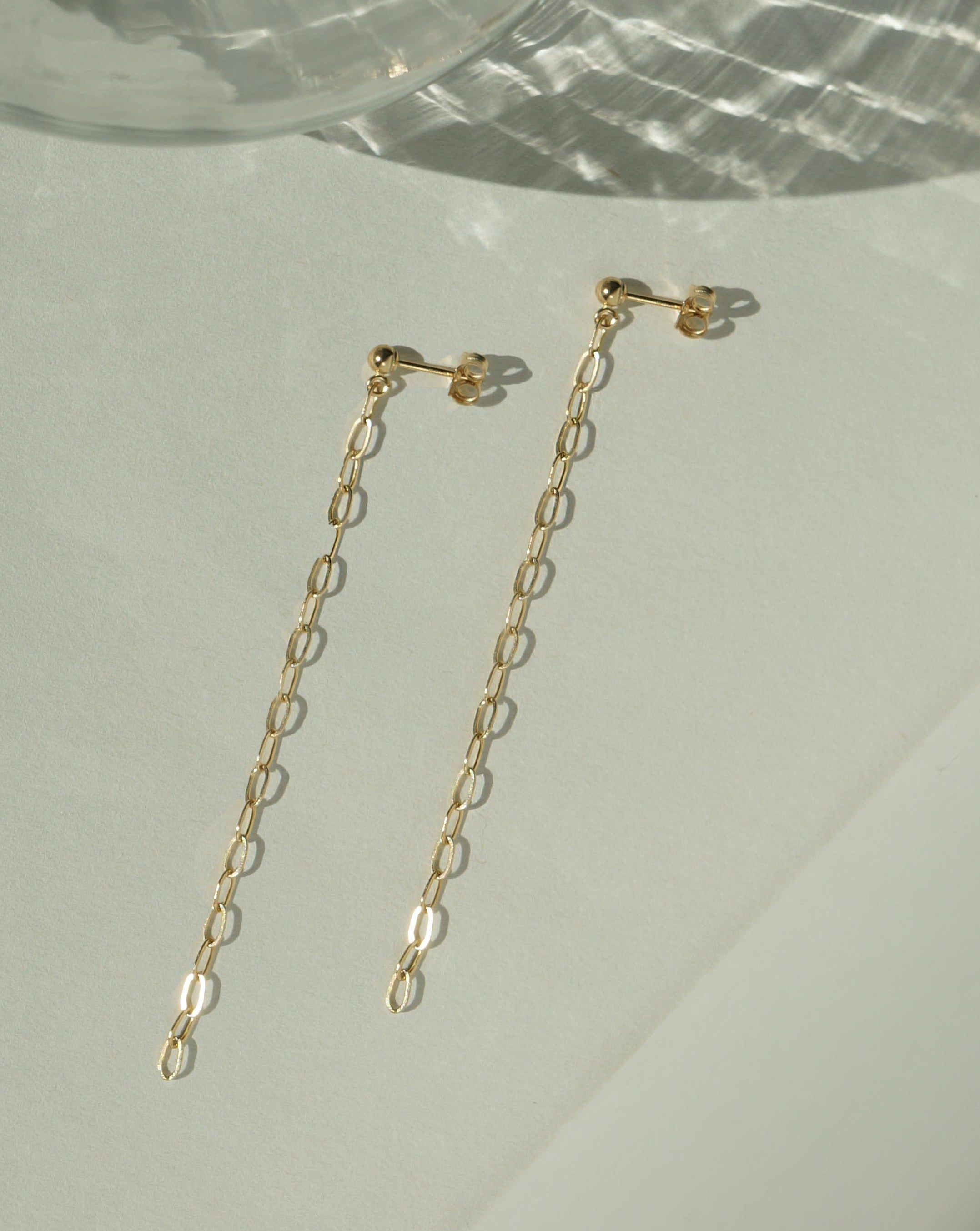 Alicia Chain Earrings by KOZAKH. Chain style drop earrings in 14K Gold Filled. Earring drop is 1.5 inches.
