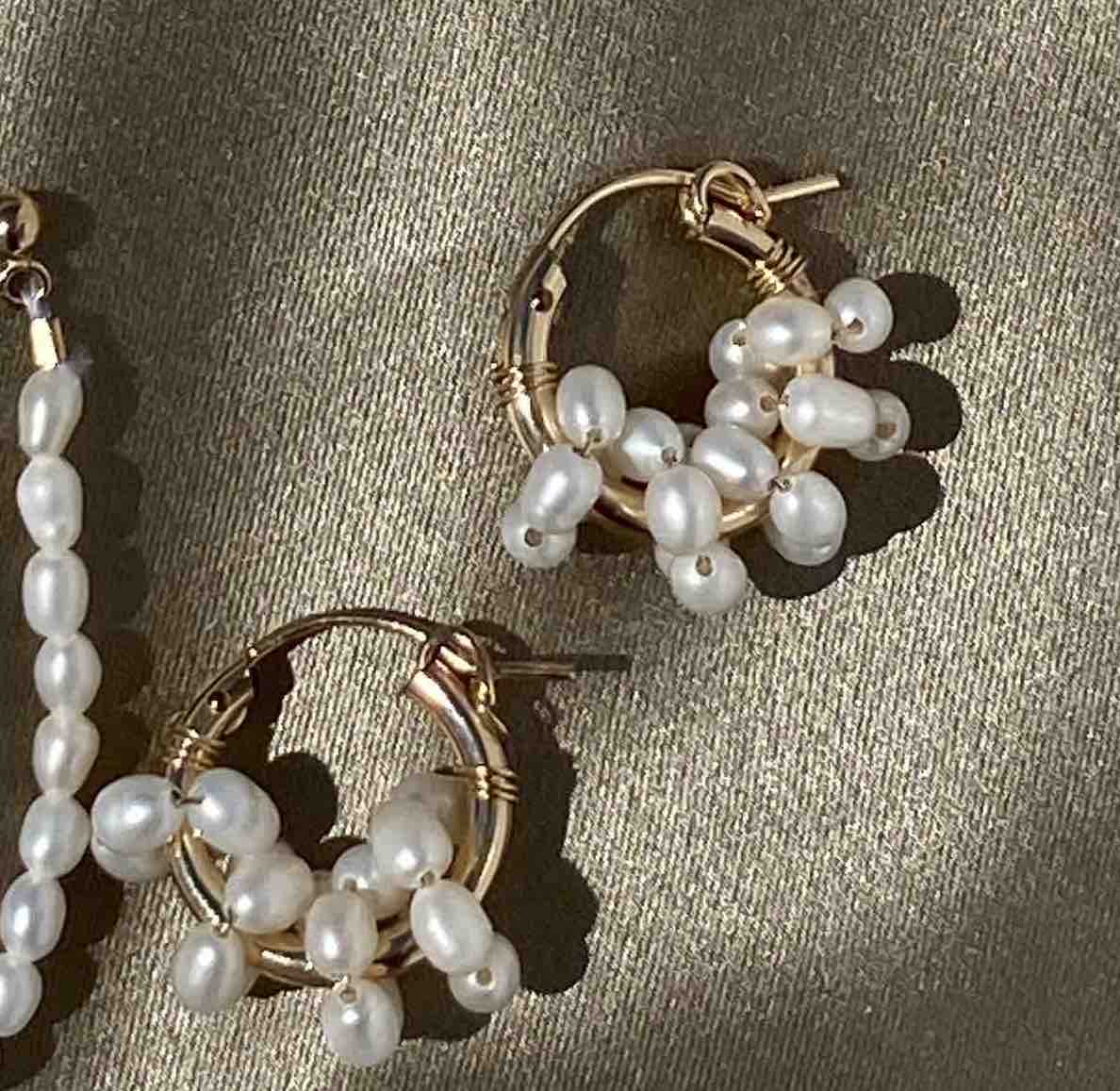 Areese Hoop Earrings by KOZAKH. 15mm hoop earrings with snap closure, crafted in 14K Gold Filled and embellished with 5mm white Rice Pearls.