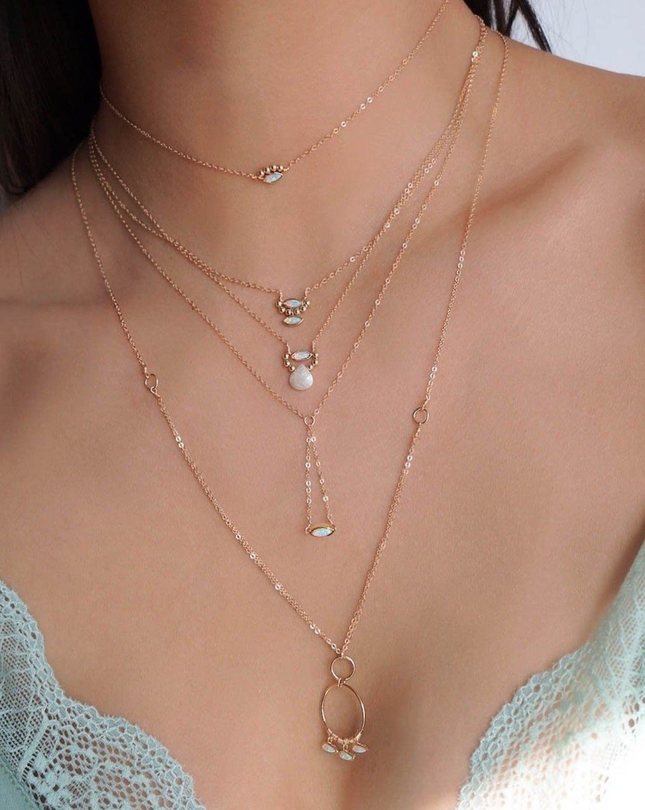 Arlan Necklace by KOZAKH. A 16 to 18 inch adjustable length, 1 inch drop lariat style necklace in 14K Gold Filled, featuring a Marquise Opal charm.