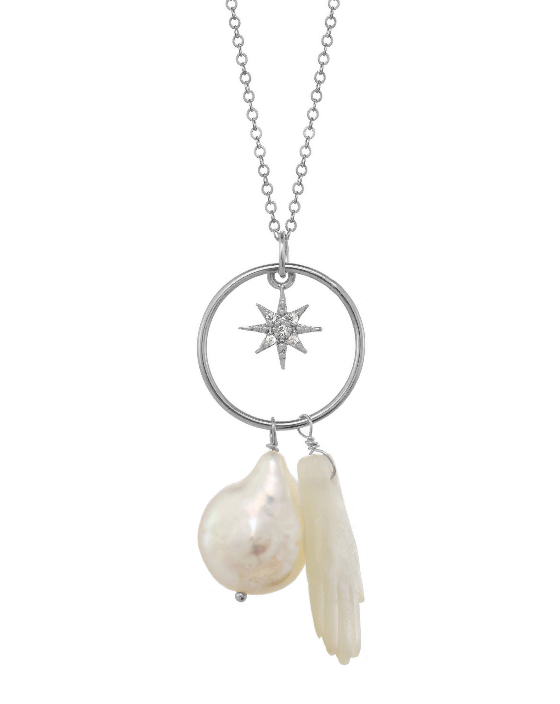 Astera Necklace by KOZAKH. An 18 to 20 inch adjustable length necklace in Sterling Silver, featuring a hand carved Mother of Pearl hand charm, a Baroque Pearl, and a Cubic Zirconia star charm.