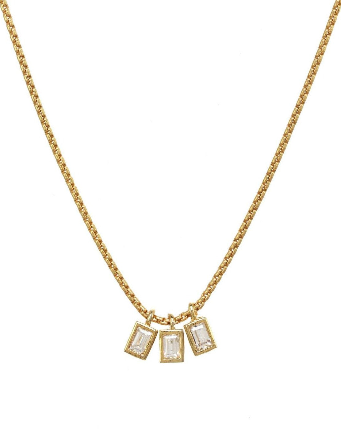 Avery Necklace by KOZAKH. A 16 to 18 inch adjustable length necklace in 14K Gold Filled, featuring 3 square cut Cubic Zirconias.