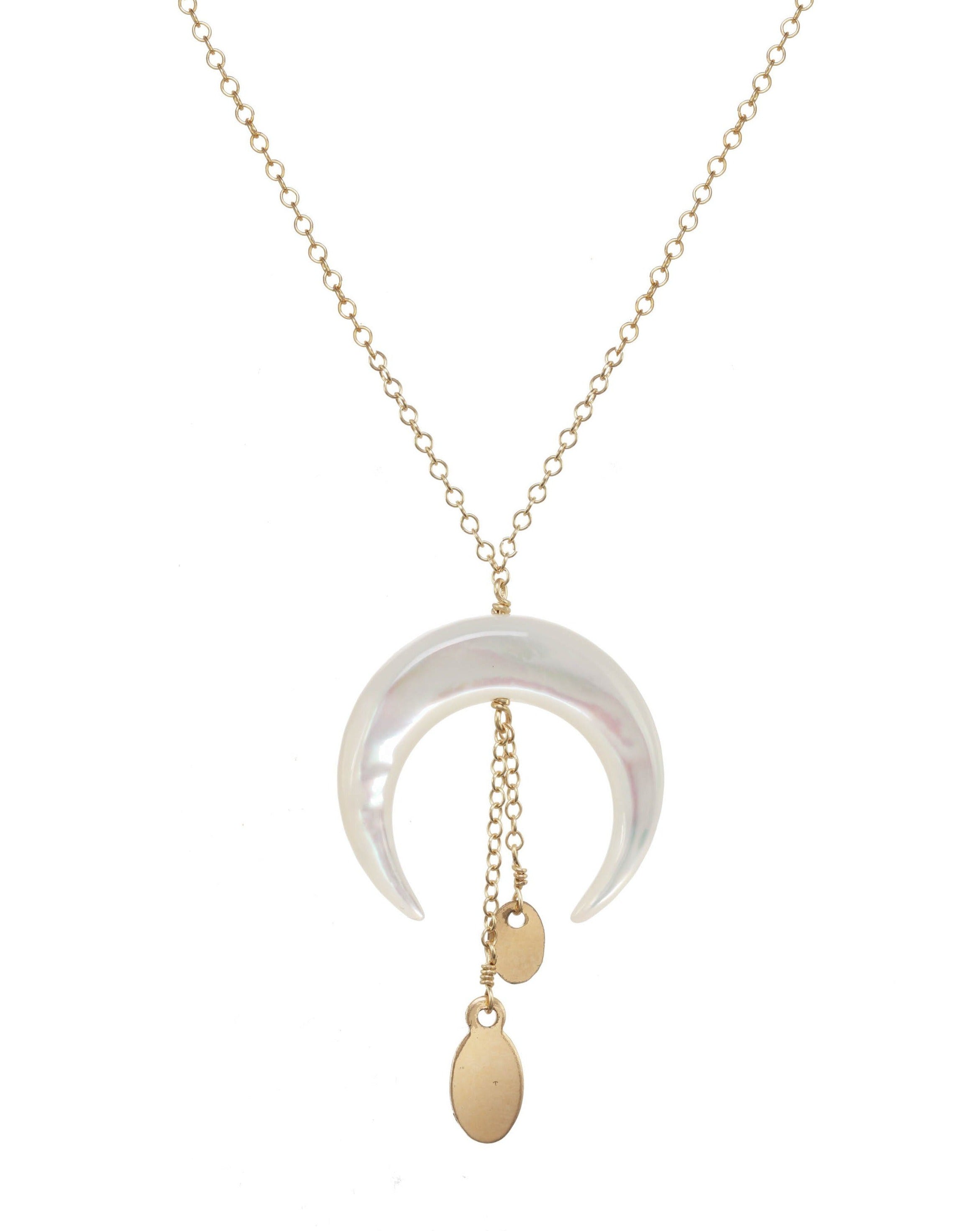 Baque Monita Necklace by KOZAKH. A 16 to 18 inch adjustable length necklace in 14K Gold Filled, featuring a hand-carved Mother of Pearl moon charm and a 1/2 inch chain drop.
