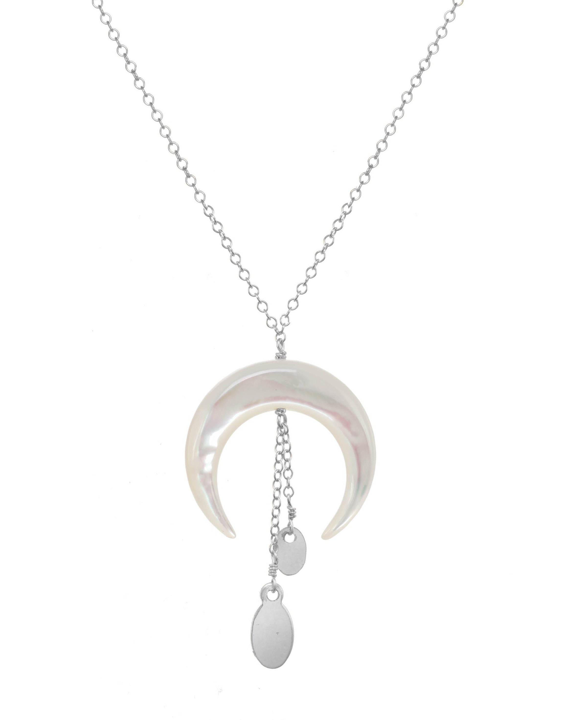 Baque Monita Necklace by KOZAKH. A 16 to 18 inch adjustable length necklace in Sterling Silver, featuring a hand-carved Mother of Pearl moon charm and a 1/2 inch chain drop.