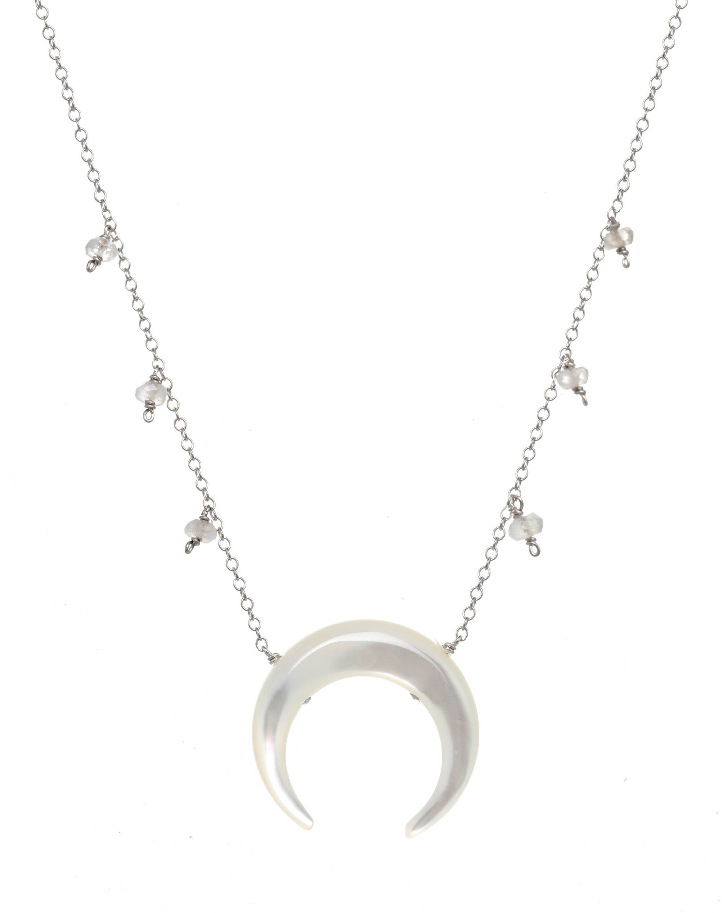 Baque Moon Necklace by KOZAKH. A 16 to 18 inch adjustable length necklace in Sterling Silver, featuring a 20mm hand-carved Mother of Pearl moon charm and 2mm faceted Moonstones.