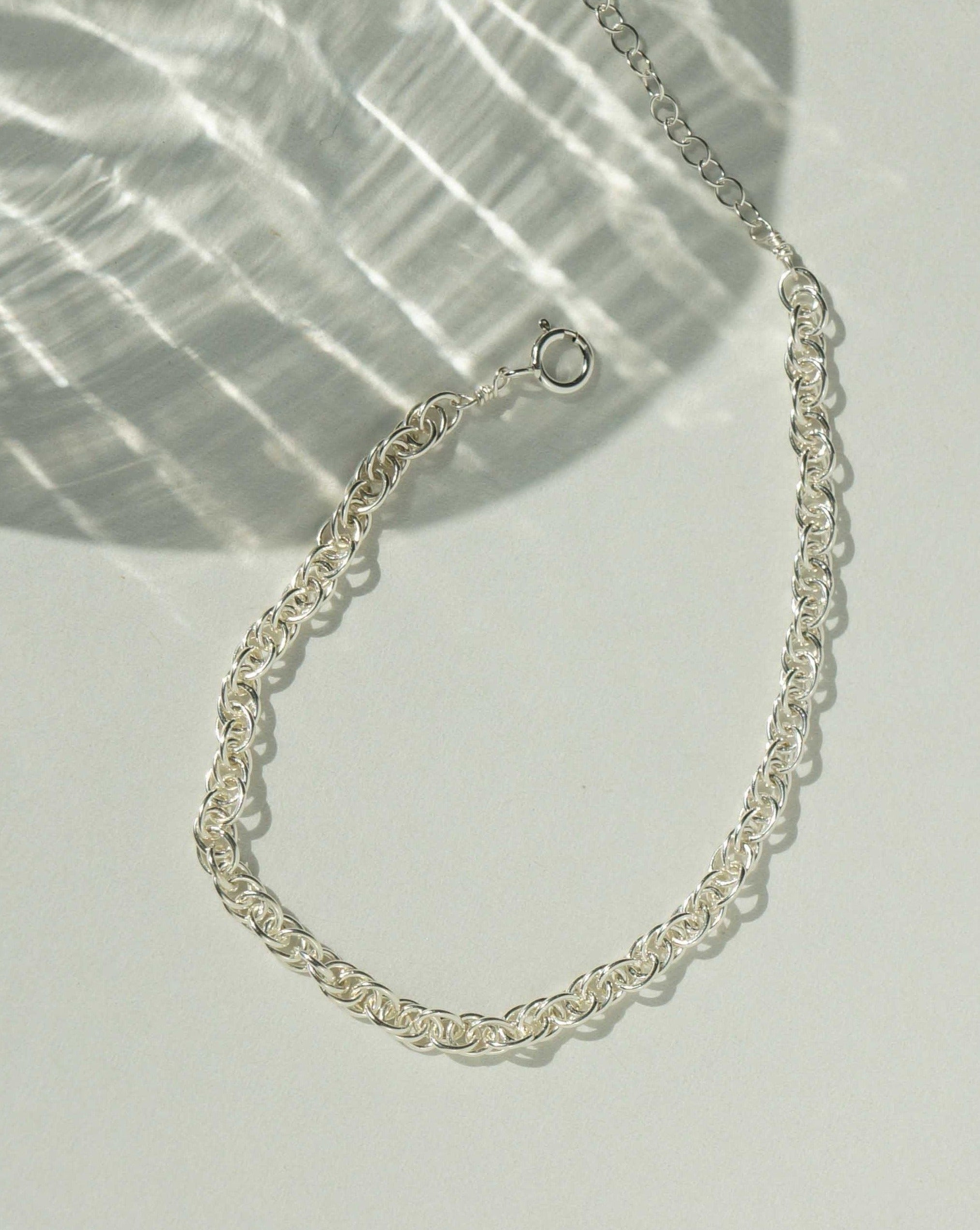 Beth Bracelet by KOZAKH. A 6 to 7 inch adjustable length bracelet in Sterling Silver. It is a 3.4mm thick twisted rope link chain style bracelet.